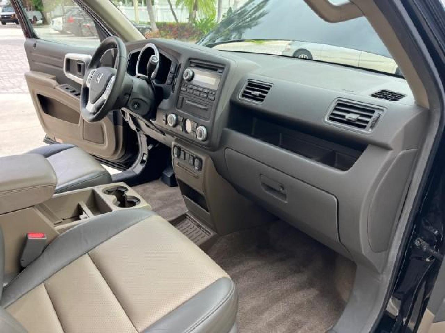 2006 Nighthawk Black Pearl /Gray Honda Ridgeline RTL SUNROOF LOW MILES 82,704 (2HJYK16546H) with an 3.5L SOHC PGM-FI 24-Valve VTEC V6 Engine engine, Automatic transmission, located at 4701 North Dixie Hwy, Pompano Beach, FL, 33064, (954) 422-2889, 26.240938, -80.123474 - OUR WEBPAGE FLORIDACARS1.COM HAS OVER 100 PHOTOS AND FREE CARFAX LINK 2006 HONDA RIDGELINE RTL ROAD READY 3.5L V6 VIN: 2HJYK16546H553594 NO ACCIDENTS CREW PICKUP NO RECALLS AWD 3.5L V6 F SOHC LOW MILES 82,704 GASOLINE POWER SUNROOF ALL WHEEL DRIVE 5 FT BED LENGHT POWER LEATHER SEATS 5.0' Bed Length - Photo#26