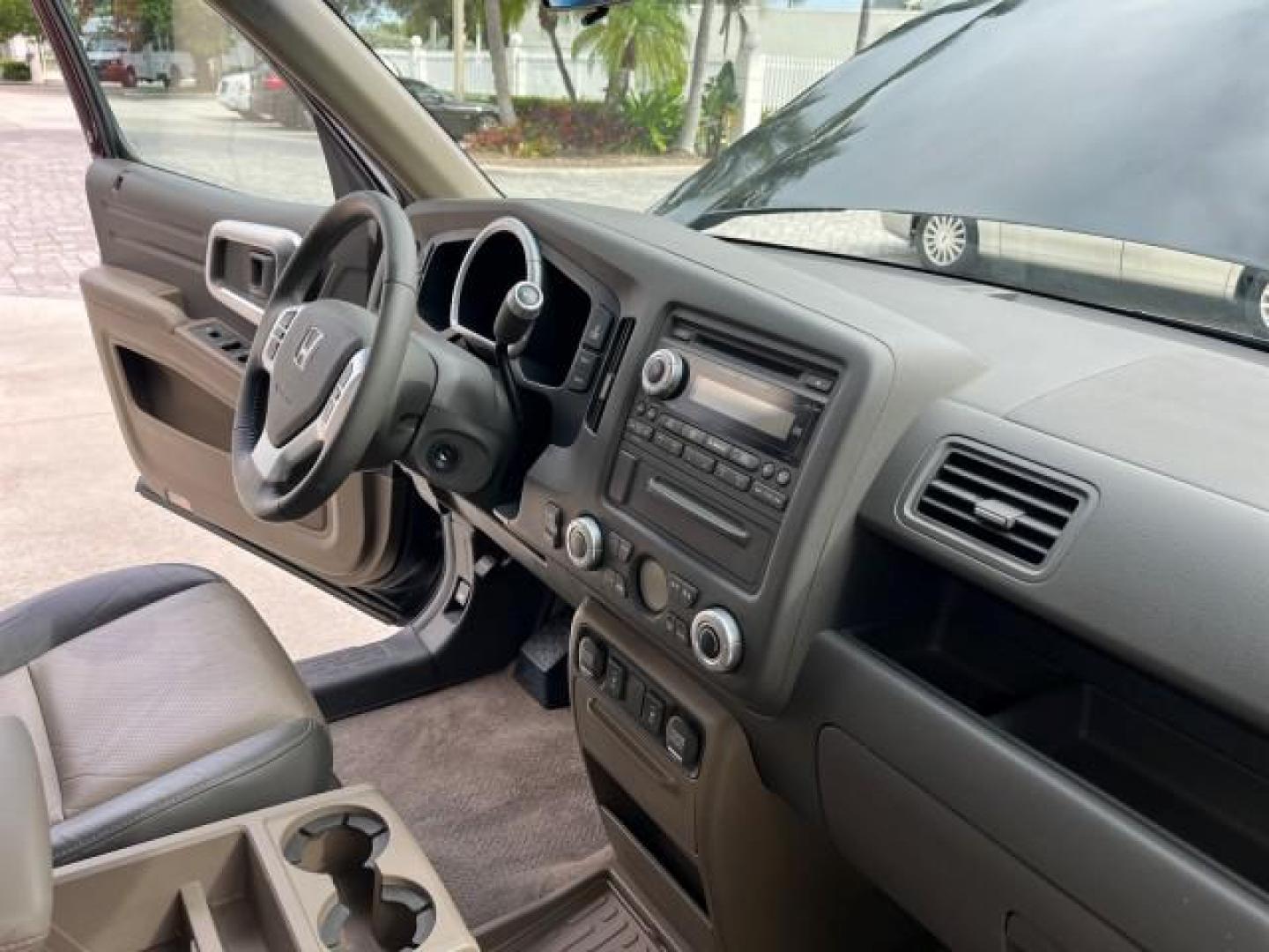 2006 Nighthawk Black Pearl /Gray Honda Ridgeline RTL SUNROOF LOW MILES 82,704 (2HJYK16546H) with an 3.5L SOHC PGM-FI 24-Valve VTEC V6 Engine engine, Automatic transmission, located at 4701 North Dixie Hwy, Pompano Beach, FL, 33064, (954) 422-2889, 26.240938, -80.123474 - OUR WEBPAGE FLORIDACARS1.COM HAS OVER 100 PHOTOS AND FREE CARFAX LINK 2006 HONDA RIDGELINE RTL ROAD READY 3.5L V6 VIN: 2HJYK16546H553594 NO ACCIDENTS CREW PICKUP NO RECALLS AWD 3.5L V6 F SOHC LOW MILES 82,704 GASOLINE POWER SUNROOF ALL WHEEL DRIVE 5 FT BED LENGHT POWER LEATHER SEATS 5.0' Bed Length - Photo#28