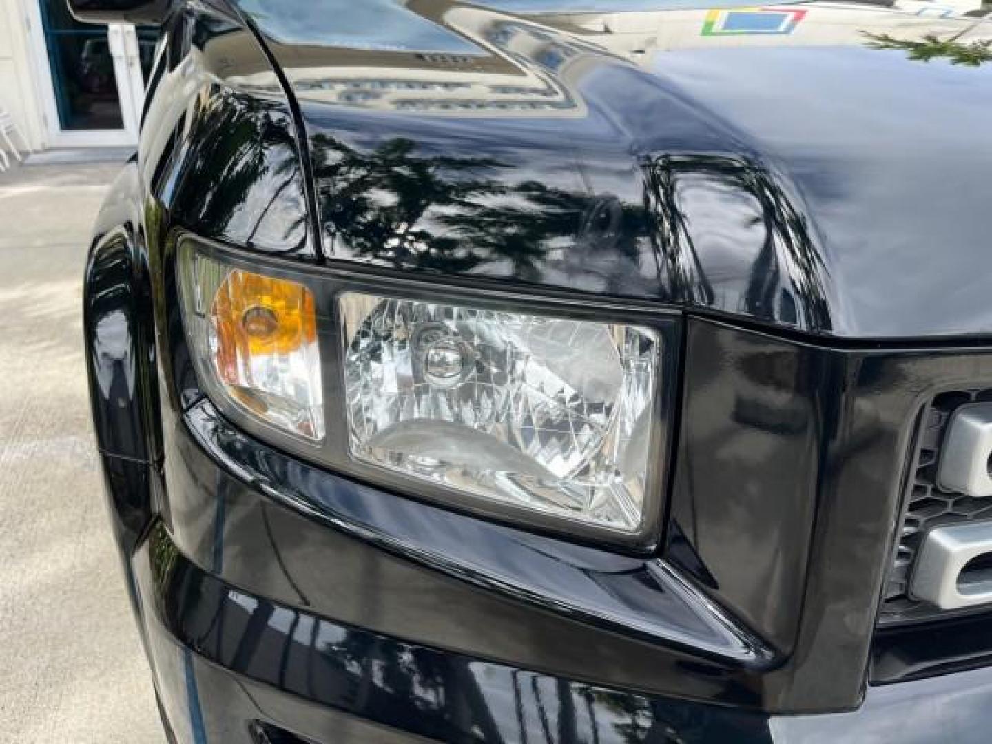 2006 Nighthawk Black Pearl /Gray Honda Ridgeline RTL SUNROOF LOW MILES 82,704 (2HJYK16546H) with an 3.5L SOHC PGM-FI 24-Valve VTEC V6 Engine engine, Automatic transmission, located at 4701 North Dixie Hwy, Pompano Beach, FL, 33064, (954) 422-2889, 26.240938, -80.123474 - OUR WEBPAGE FLORIDACARS1.COM HAS OVER 100 PHOTOS AND FREE CARFAX LINK 2006 HONDA RIDGELINE RTL ROAD READY 3.5L V6 VIN: 2HJYK16546H553594 NO ACCIDENTS CREW PICKUP NO RECALLS AWD 3.5L V6 F SOHC LOW MILES 82,704 GASOLINE POWER SUNROOF ALL WHEEL DRIVE 5 FT BED LENGHT POWER LEATHER SEATS 5.0' Bed Length - Photo#79