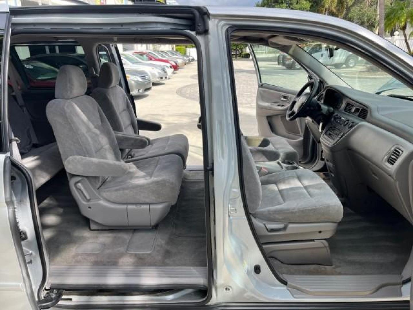 2002 Starlight Silver Metallic /Ivory Honda Odyssey 40 SERV EX LOW MILES 75,829 (2HKRL18612H) with an 3.5L SOHC MPFI 24-Valve VTEC V6 Engine engine, Automatic transmission, located at 4701 North Dixie Hwy, Pompano Beach, FL, 33064, (954) 422-2889, 26.240938, -80.123474 - OUR WEBPAGE FLORIDACARS1.COM HAS OVER 100 PHOTOS AND FREE CARFAX LINK 2002 HONDA ODYSSEY EX ROAD READY 3.5L V6 VIN: 2HKRL18612H522476 NO ACCIDENTS 25 MPG VAN LOW MILES 75,829 3.5L V6 F SOHC FLORIDA OWNER GASOLINE 3 ROW SEATS FRONT WHEEL DRIVE 40 SERVICE RECORDS POWER SLIDING DOORS 62,419 MILES Vehic - Photo#12