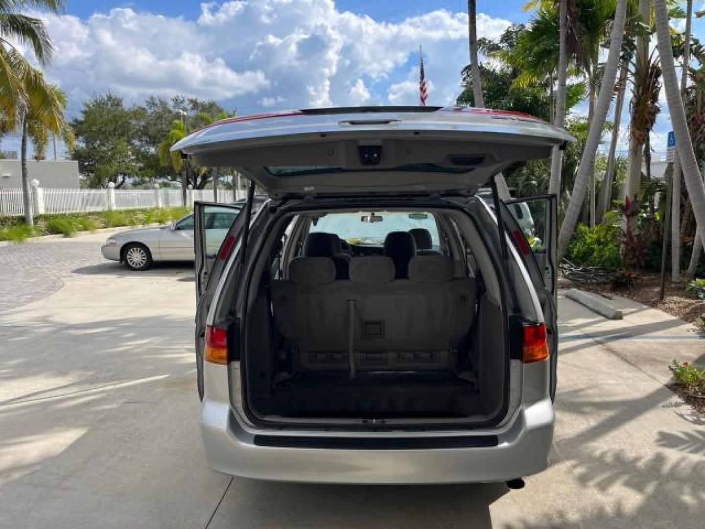 2002 Starlight Silver Metallic /Ivory Honda Odyssey 40 SERV EX LOW MILES 75,829 (2HKRL18612H) with an 3.5L SOHC MPFI 24-Valve VTEC V6 Engine engine, Automatic transmission, located at 4701 North Dixie Hwy, Pompano Beach, FL, 33064, (954) 422-2889, 26.240938, -80.123474 - OUR WEBPAGE FLORIDACARS1.COM HAS OVER 100 PHOTOS AND FREE CARFAX LINK 2002 HONDA ODYSSEY EX ROAD READY 3.5L V6 VIN: 2HKRL18612H522476 NO ACCIDENTS 25 MPG VAN LOW MILES 75,829 3.5L V6 F SOHC FLORIDA OWNER GASOLINE 3 ROW SEATS FRONT WHEEL DRIVE 40 SERVICE RECORDS POWER SLIDING DOORS 62,419 MILES Vehic - Photo#15