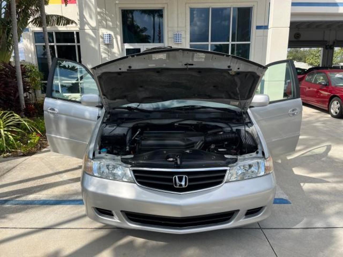 2002 Starlight Silver Metallic /Ivory Honda Odyssey 40 SERV EX LOW MILES 75,829 (2HKRL18612H) with an 3.5L SOHC MPFI 24-Valve VTEC V6 Engine engine, Automatic transmission, located at 4701 North Dixie Hwy, Pompano Beach, FL, 33064, (954) 422-2889, 26.240938, -80.123474 - OUR WEBPAGE FLORIDACARS1.COM HAS OVER 100 PHOTOS AND FREE CARFAX LINK 2002 HONDA ODYSSEY EX ROAD READY 3.5L V6 VIN: 2HKRL18612H522476 NO ACCIDENTS 25 MPG VAN LOW MILES 75,829 3.5L V6 F SOHC FLORIDA OWNER GASOLINE 3 ROW SEATS FRONT WHEEL DRIVE 40 SERVICE RECORDS POWER SLIDING DOORS 62,419 MILES Vehic - Photo#16