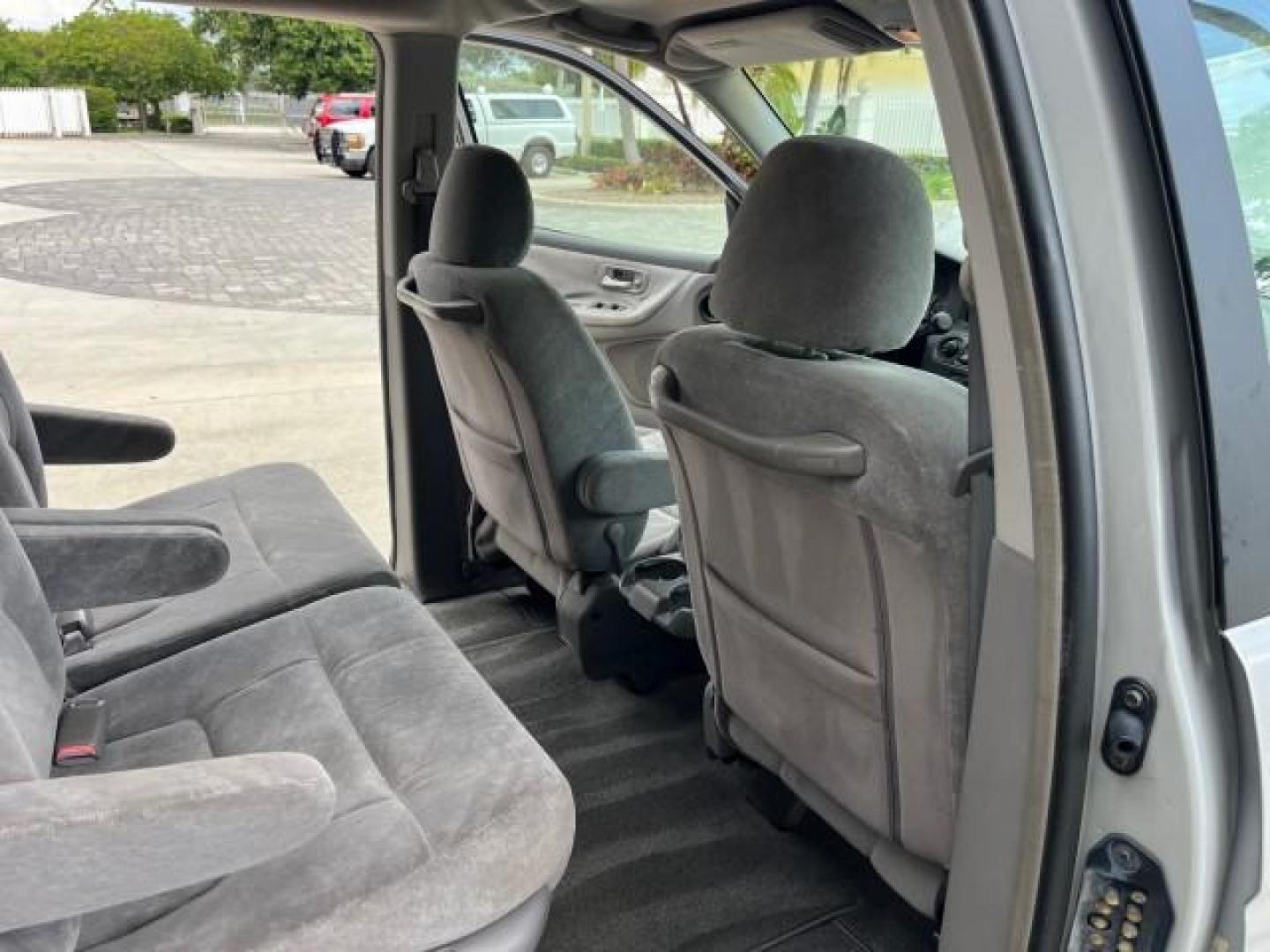 2002 Starlight Silver Metallic /Ivory Honda Odyssey 40 SERV EX LOW MILES 75,829 (2HKRL18612H) with an 3.5L SOHC MPFI 24-Valve VTEC V6 Engine engine, Automatic transmission, located at 4701 North Dixie Hwy, Pompano Beach, FL, 33064, (954) 422-2889, 26.240938, -80.123474 - OUR WEBPAGE FLORIDACARS1.COM HAS OVER 100 PHOTOS AND FREE CARFAX LINK 2002 HONDA ODYSSEY EX ROAD READY 3.5L V6 VIN: 2HKRL18612H522476 NO ACCIDENTS 25 MPG VAN LOW MILES 75,829 3.5L V6 F SOHC FLORIDA OWNER GASOLINE 3 ROW SEATS FRONT WHEEL DRIVE 40 SERVICE RECORDS POWER SLIDING DOORS 62,419 MILES Vehic - Photo#30