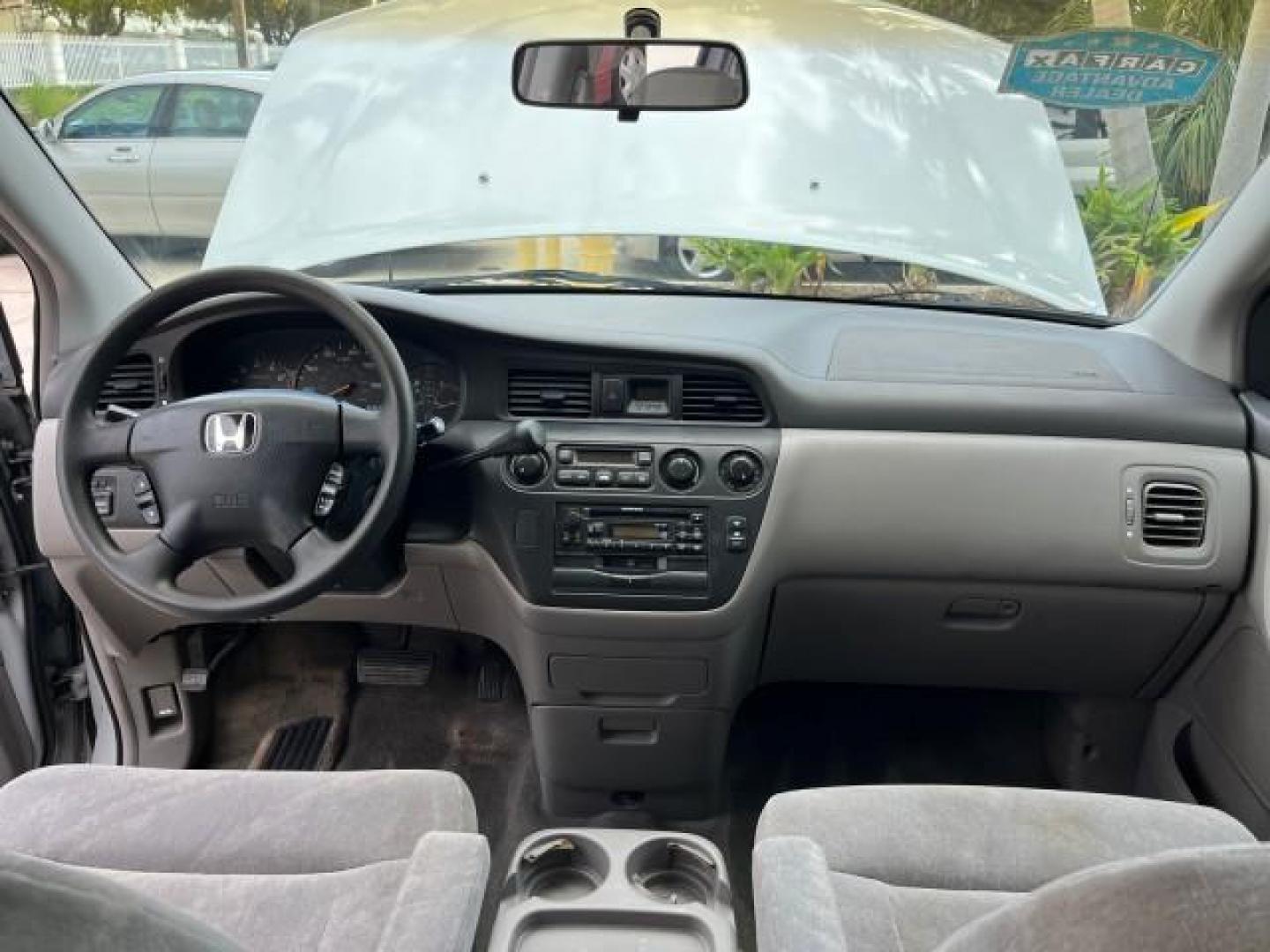 2002 Starlight Silver Metallic /Ivory Honda Odyssey 40 SERV EX LOW MILES 75,829 (2HKRL18612H) with an 3.5L SOHC MPFI 24-Valve VTEC V6 Engine engine, Automatic transmission, located at 4701 North Dixie Hwy, Pompano Beach, FL, 33064, (954) 422-2889, 26.240938, -80.123474 - OUR WEBPAGE FLORIDACARS1.COM HAS OVER 100 PHOTOS AND FREE CARFAX LINK 2002 HONDA ODYSSEY EX ROAD READY 3.5L V6 VIN: 2HKRL18612H522476 NO ACCIDENTS 25 MPG VAN LOW MILES 75,829 3.5L V6 F SOHC FLORIDA OWNER GASOLINE 3 ROW SEATS FRONT WHEEL DRIVE 40 SERVICE RECORDS POWER SLIDING DOORS 62,419 MILES Vehic - Photo#32