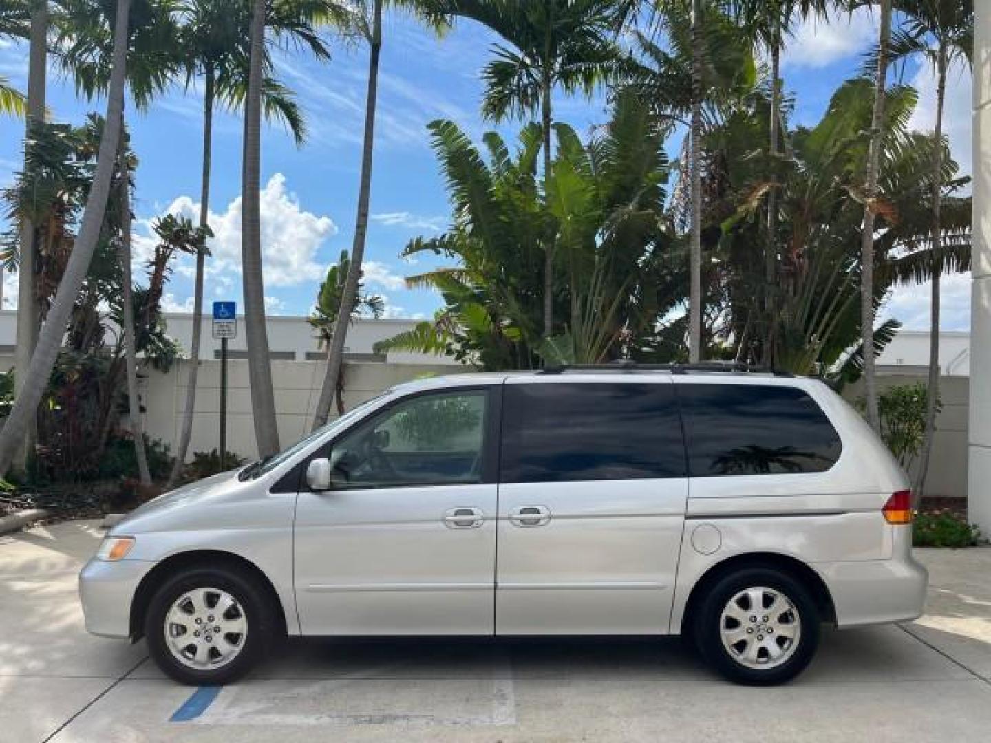 2002 Starlight Silver Metallic /Ivory Honda Odyssey 40 SERV EX LOW MILES 75,829 (2HKRL18612H) with an 3.5L SOHC MPFI 24-Valve VTEC V6 Engine engine, Automatic transmission, located at 4701 North Dixie Hwy, Pompano Beach, FL, 33064, (954) 422-2889, 26.240938, -80.123474 - OUR WEBPAGE FLORIDACARS1.COM HAS OVER 100 PHOTOS AND FREE CARFAX LINK 2002 HONDA ODYSSEY EX ROAD READY 3.5L V6 VIN: 2HKRL18612H522476 NO ACCIDENTS 25 MPG VAN LOW MILES 75,829 3.5L V6 F SOHC FLORIDA OWNER GASOLINE 3 ROW SEATS FRONT WHEEL DRIVE 40 SERVICE RECORDS POWER SLIDING DOORS 62,419 MILES Vehic - Photo#4