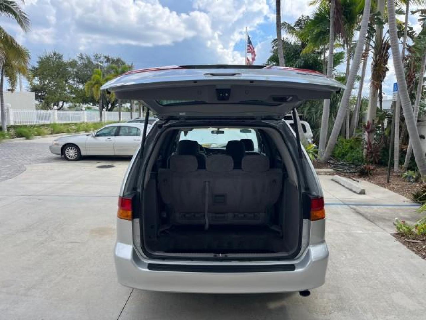 2002 Starlight Silver Metallic /Ivory Honda Odyssey 40 SERV EX LOW MILES 75,829 (2HKRL18612H) with an 3.5L SOHC MPFI 24-Valve VTEC V6 Engine engine, Automatic transmission, located at 4701 North Dixie Hwy, Pompano Beach, FL, 33064, (954) 422-2889, 26.240938, -80.123474 - OUR WEBPAGE FLORIDACARS1.COM HAS OVER 100 PHOTOS AND FREE CARFAX LINK 2002 HONDA ODYSSEY EX ROAD READY 3.5L V6 VIN: 2HKRL18612H522476 NO ACCIDENTS 25 MPG VAN LOW MILES 75,829 3.5L V6 F SOHC FLORIDA OWNER GASOLINE 3 ROW SEATS FRONT WHEEL DRIVE 40 SERVICE RECORDS POWER SLIDING DOORS 62,419 MILES Vehic - Photo#55