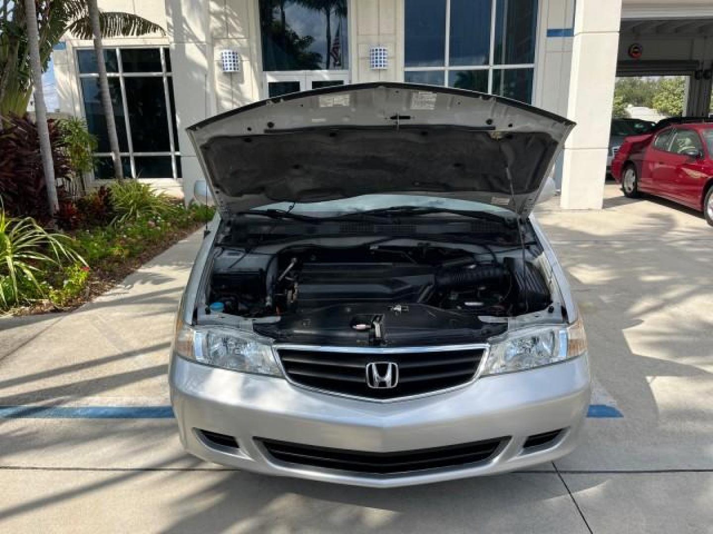 2002 Starlight Silver Metallic /Ivory Honda Odyssey 40 SERV EX LOW MILES 75,829 (2HKRL18612H) with an 3.5L SOHC MPFI 24-Valve VTEC V6 Engine engine, Automatic transmission, located at 4701 North Dixie Hwy, Pompano Beach, FL, 33064, (954) 422-2889, 26.240938, -80.123474 - OUR WEBPAGE FLORIDACARS1.COM HAS OVER 100 PHOTOS AND FREE CARFAX LINK 2002 HONDA ODYSSEY EX ROAD READY 3.5L V6 VIN: 2HKRL18612H522476 NO ACCIDENTS 25 MPG VAN LOW MILES 75,829 3.5L V6 F SOHC FLORIDA OWNER GASOLINE 3 ROW SEATS FRONT WHEEL DRIVE 40 SERVICE RECORDS POWER SLIDING DOORS 62,419 MILES Vehic - Photo#63