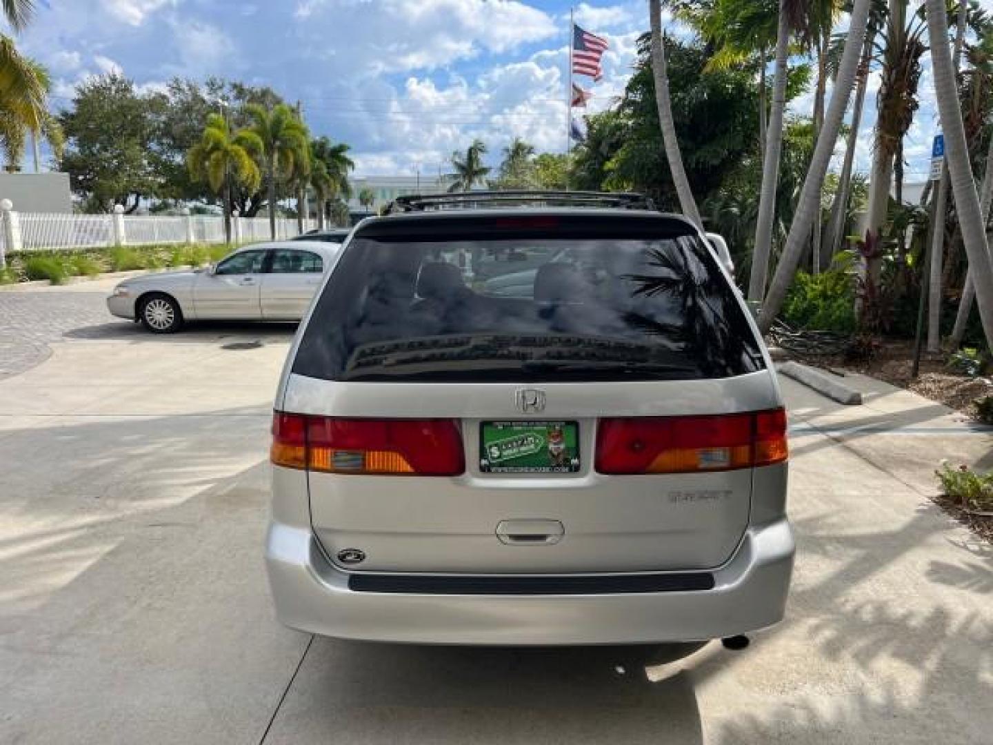 2002 Starlight Silver Metallic /Ivory Honda Odyssey 40 SERV EX LOW MILES 75,829 (2HKRL18612H) with an 3.5L SOHC MPFI 24-Valve VTEC V6 Engine engine, Automatic transmission, located at 4701 North Dixie Hwy, Pompano Beach, FL, 33064, (954) 422-2889, 26.240938, -80.123474 - OUR WEBPAGE FLORIDACARS1.COM HAS OVER 100 PHOTOS AND FREE CARFAX LINK 2002 HONDA ODYSSEY EX ROAD READY 3.5L V6 VIN: 2HKRL18612H522476 NO ACCIDENTS 25 MPG VAN LOW MILES 75,829 3.5L V6 F SOHC FLORIDA OWNER GASOLINE 3 ROW SEATS FRONT WHEEL DRIVE 40 SERVICE RECORDS POWER SLIDING DOORS 62,419 MILES Vehic - Photo#6