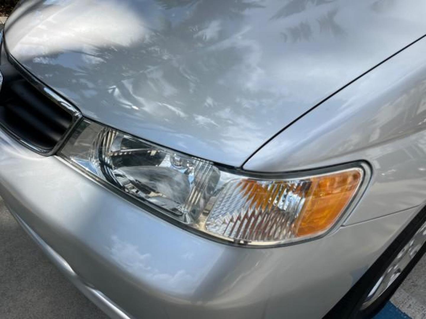 2002 Starlight Silver Metallic /Ivory Honda Odyssey 40 SERV EX LOW MILES 75,829 (2HKRL18612H) with an 3.5L SOHC MPFI 24-Valve VTEC V6 Engine engine, Automatic transmission, located at 4701 North Dixie Hwy, Pompano Beach, FL, 33064, (954) 422-2889, 26.240938, -80.123474 - OUR WEBPAGE FLORIDACARS1.COM HAS OVER 100 PHOTOS AND FREE CARFAX LINK 2002 HONDA ODYSSEY EX ROAD READY 3.5L V6 VIN: 2HKRL18612H522476 NO ACCIDENTS 25 MPG VAN LOW MILES 75,829 3.5L V6 F SOHC FLORIDA OWNER GASOLINE 3 ROW SEATS FRONT WHEEL DRIVE 40 SERVICE RECORDS POWER SLIDING DOORS 62,419 MILES Vehic - Photo#73