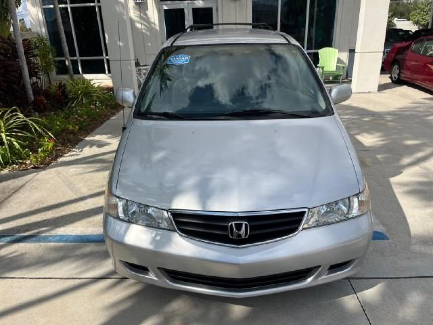 2002 Starlight Silver Metallic /Ivory Honda Odyssey 40 SERV EX LOW MILES 75,829 (2HKRL18612H) with an 3.5L SOHC MPFI 24-Valve VTEC V6 Engine engine, Automatic transmission, located at 4701 North Dixie Hwy, Pompano Beach, FL, 33064, (954) 422-2889, 26.240938, -80.123474 - OUR WEBPAGE FLORIDACARS1.COM HAS OVER 100 PHOTOS AND FREE CARFAX LINK 2002 HONDA ODYSSEY EX ROAD READY 3.5L V6 VIN: 2HKRL18612H522476 NO ACCIDENTS 25 MPG VAN LOW MILES 75,829 3.5L V6 F SOHC FLORIDA OWNER GASOLINE 3 ROW SEATS FRONT WHEEL DRIVE 40 SERVICE RECORDS POWER SLIDING DOORS 62,419 MILES Vehic - Photo#76