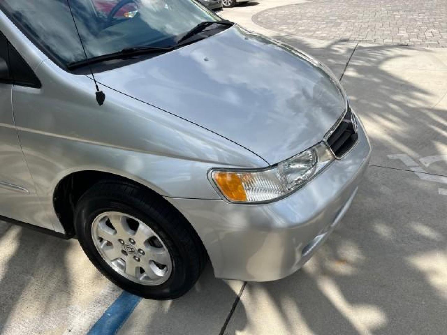 2002 Starlight Silver Metallic /Ivory Honda Odyssey 40 SERV EX LOW MILES 75,829 (2HKRL18612H) with an 3.5L SOHC MPFI 24-Valve VTEC V6 Engine engine, Automatic transmission, located at 4701 North Dixie Hwy, Pompano Beach, FL, 33064, (954) 422-2889, 26.240938, -80.123474 - OUR WEBPAGE FLORIDACARS1.COM HAS OVER 100 PHOTOS AND FREE CARFAX LINK 2002 HONDA ODYSSEY EX ROAD READY 3.5L V6 VIN: 2HKRL18612H522476 NO ACCIDENTS 25 MPG VAN LOW MILES 75,829 3.5L V6 F SOHC FLORIDA OWNER GASOLINE 3 ROW SEATS FRONT WHEEL DRIVE 40 SERVICE RECORDS POWER SLIDING DOORS 62,419 MILES Vehic - Photo#77