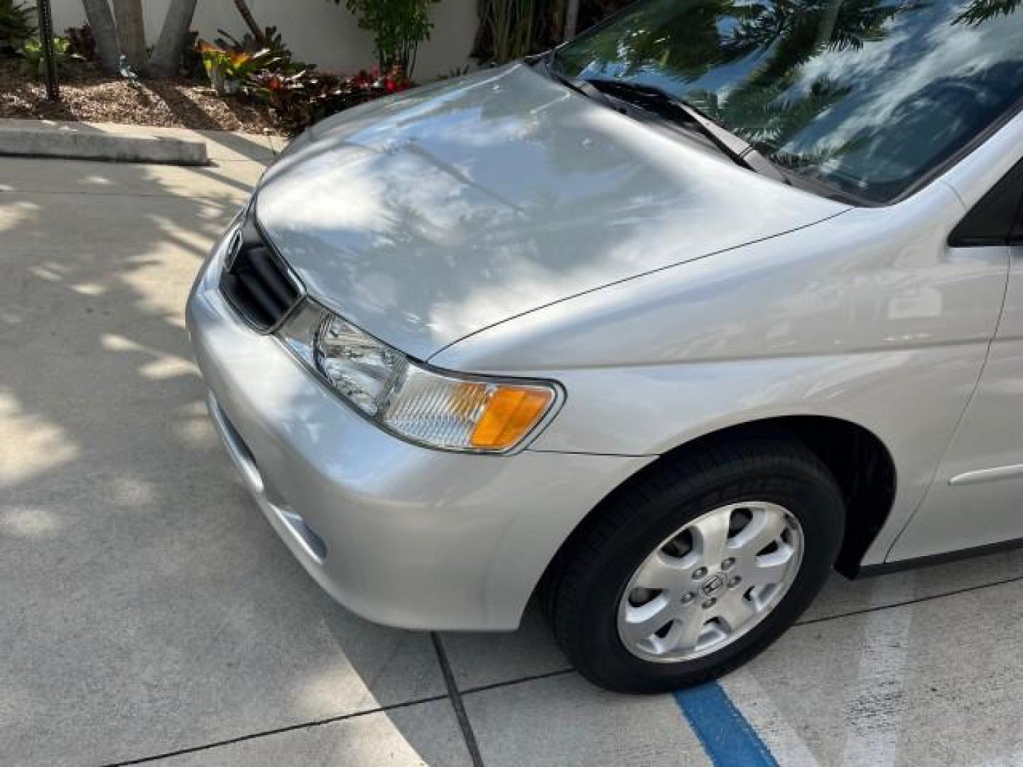 2002 Starlight Silver Metallic /Ivory Honda Odyssey 40 SERV EX LOW MILES 75,829 (2HKRL18612H) with an 3.5L SOHC MPFI 24-Valve VTEC V6 Engine engine, Automatic transmission, located at 4701 North Dixie Hwy, Pompano Beach, FL, 33064, (954) 422-2889, 26.240938, -80.123474 - OUR WEBPAGE FLORIDACARS1.COM HAS OVER 100 PHOTOS AND FREE CARFAX LINK 2002 HONDA ODYSSEY EX ROAD READY 3.5L V6 VIN: 2HKRL18612H522476 NO ACCIDENTS 25 MPG VAN LOW MILES 75,829 3.5L V6 F SOHC FLORIDA OWNER GASOLINE 3 ROW SEATS FRONT WHEEL DRIVE 40 SERVICE RECORDS POWER SLIDING DOORS 62,419 MILES Vehic - Photo#78