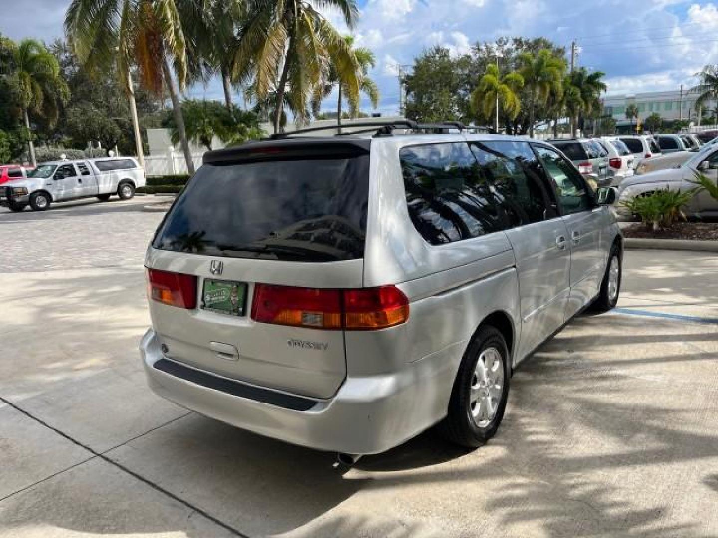 2002 Starlight Silver Metallic /Ivory Honda Odyssey 40 SERV EX LOW MILES 75,829 (2HKRL18612H) with an 3.5L SOHC MPFI 24-Valve VTEC V6 Engine engine, Automatic transmission, located at 4701 North Dixie Hwy, Pompano Beach, FL, 33064, (954) 422-2889, 26.240938, -80.123474 - OUR WEBPAGE FLORIDACARS1.COM HAS OVER 100 PHOTOS AND FREE CARFAX LINK 2002 HONDA ODYSSEY EX ROAD READY 3.5L V6 VIN: 2HKRL18612H522476 NO ACCIDENTS 25 MPG VAN LOW MILES 75,829 3.5L V6 F SOHC FLORIDA OWNER GASOLINE 3 ROW SEATS FRONT WHEEL DRIVE 40 SERVICE RECORDS POWER SLIDING DOORS 62,419 MILES Vehic - Photo#7