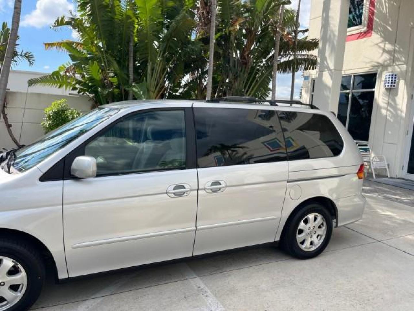 2002 Starlight Silver Metallic /Ivory Honda Odyssey 40 SERV EX LOW MILES 75,829 (2HKRL18612H) with an 3.5L SOHC MPFI 24-Valve VTEC V6 Engine engine, Automatic transmission, located at 4701 North Dixie Hwy, Pompano Beach, FL, 33064, (954) 422-2889, 26.240938, -80.123474 - OUR WEBPAGE FLORIDACARS1.COM HAS OVER 100 PHOTOS AND FREE CARFAX LINK 2002 HONDA ODYSSEY EX ROAD READY 3.5L V6 VIN: 2HKRL18612H522476 NO ACCIDENTS 25 MPG VAN LOW MILES 75,829 3.5L V6 F SOHC FLORIDA OWNER GASOLINE 3 ROW SEATS FRONT WHEEL DRIVE 40 SERVICE RECORDS POWER SLIDING DOORS 62,419 MILES Vehic - Photo#79