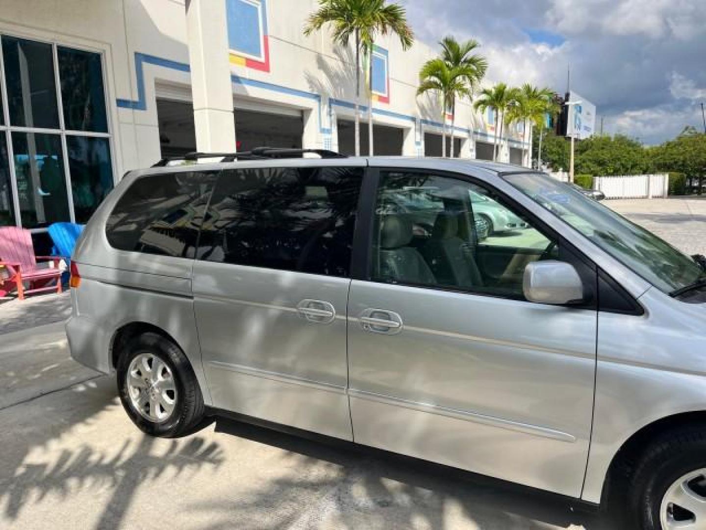 2002 Starlight Silver Metallic /Ivory Honda Odyssey 40 SERV EX LOW MILES 75,829 (2HKRL18612H) with an 3.5L SOHC MPFI 24-Valve VTEC V6 Engine engine, Automatic transmission, located at 4701 North Dixie Hwy, Pompano Beach, FL, 33064, (954) 422-2889, 26.240938, -80.123474 - OUR WEBPAGE FLORIDACARS1.COM HAS OVER 100 PHOTOS AND FREE CARFAX LINK 2002 HONDA ODYSSEY EX ROAD READY 3.5L V6 VIN: 2HKRL18612H522476 NO ACCIDENTS 25 MPG VAN LOW MILES 75,829 3.5L V6 F SOHC FLORIDA OWNER GASOLINE 3 ROW SEATS FRONT WHEEL DRIVE 40 SERVICE RECORDS POWER SLIDING DOORS 62,419 MILES Vehic - Photo#80