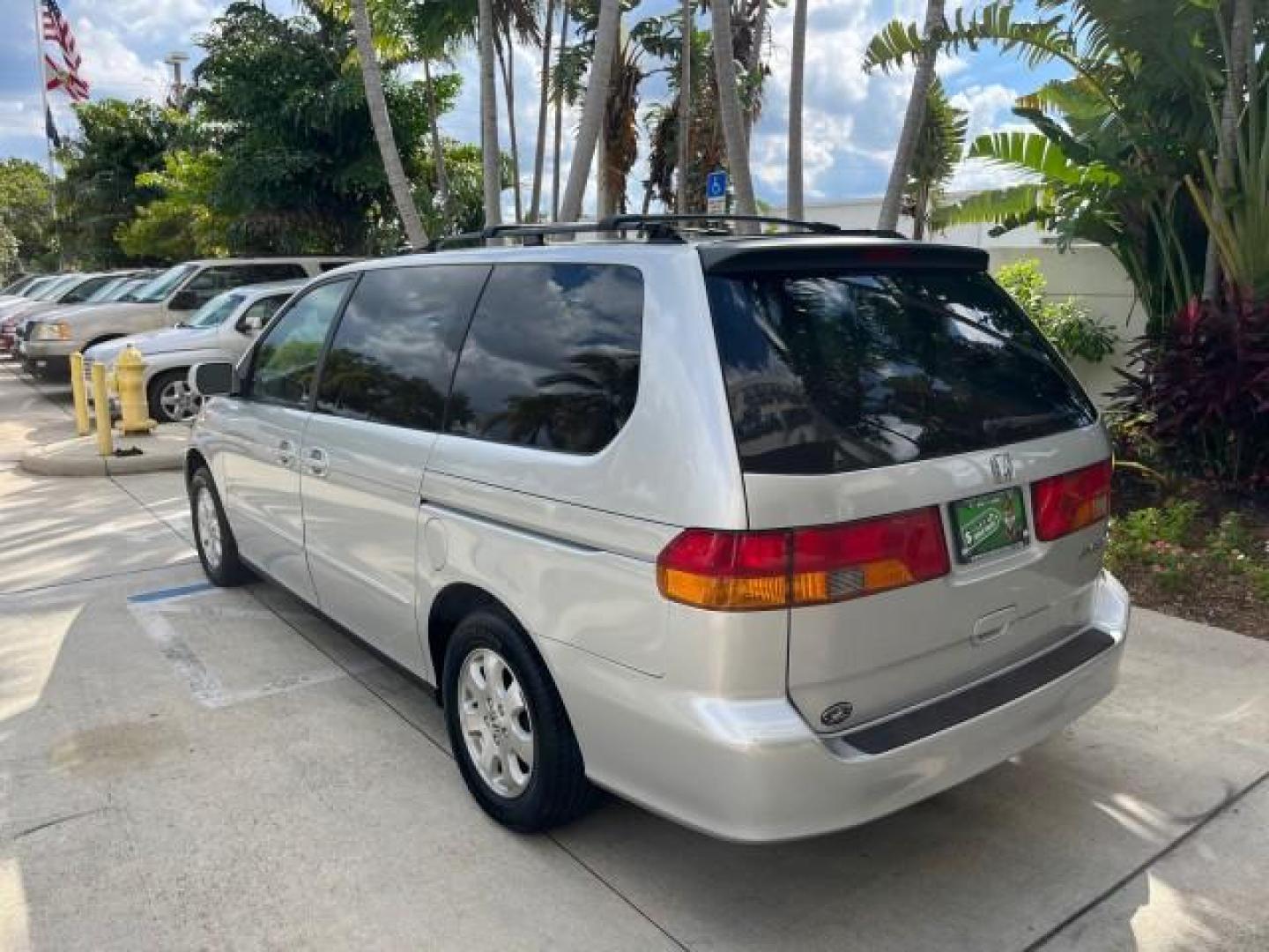 2002 Starlight Silver Metallic /Ivory Honda Odyssey 40 SERV EX LOW MILES 75,829 (2HKRL18612H) with an 3.5L SOHC MPFI 24-Valve VTEC V6 Engine engine, Automatic transmission, located at 4701 North Dixie Hwy, Pompano Beach, FL, 33064, (954) 422-2889, 26.240938, -80.123474 - OUR WEBPAGE FLORIDACARS1.COM HAS OVER 100 PHOTOS AND FREE CARFAX LINK 2002 HONDA ODYSSEY EX ROAD READY 3.5L V6 VIN: 2HKRL18612H522476 NO ACCIDENTS 25 MPG VAN LOW MILES 75,829 3.5L V6 F SOHC FLORIDA OWNER GASOLINE 3 ROW SEATS FRONT WHEEL DRIVE 40 SERVICE RECORDS POWER SLIDING DOORS 62,419 MILES Vehic - Photo#90