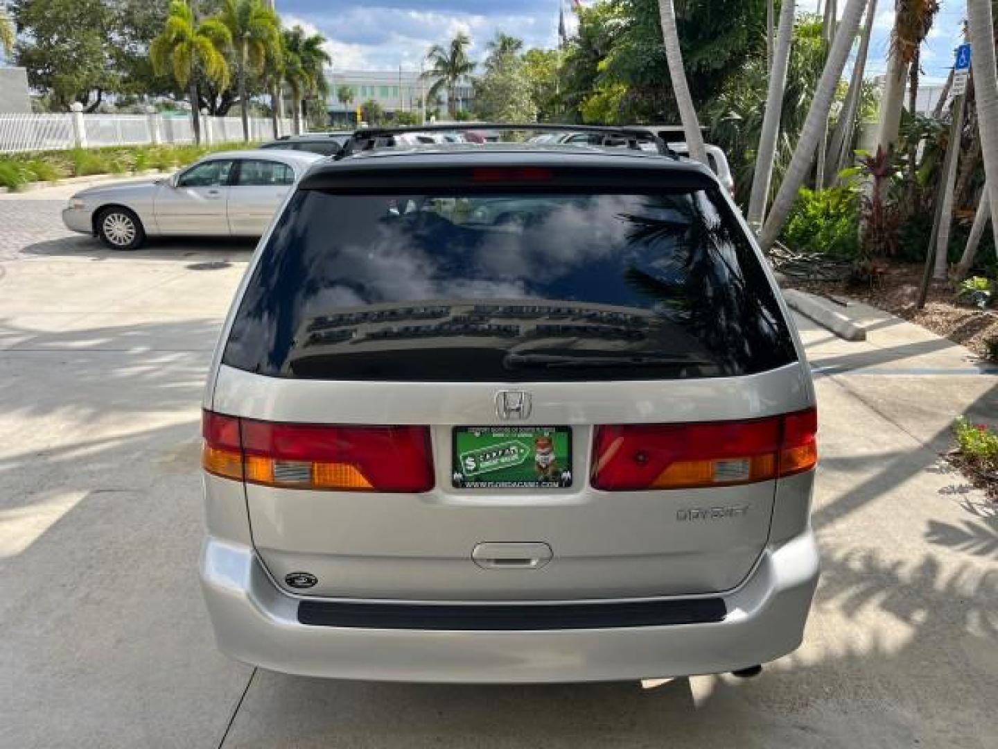 2002 Starlight Silver Metallic /Ivory Honda Odyssey 40 SERV EX LOW MILES 75,829 (2HKRL18612H) with an 3.5L SOHC MPFI 24-Valve VTEC V6 Engine engine, Automatic transmission, located at 4701 North Dixie Hwy, Pompano Beach, FL, 33064, (954) 422-2889, 26.240938, -80.123474 - OUR WEBPAGE FLORIDACARS1.COM HAS OVER 100 PHOTOS AND FREE CARFAX LINK 2002 HONDA ODYSSEY EX ROAD READY 3.5L V6 VIN: 2HKRL18612H522476 NO ACCIDENTS 25 MPG VAN LOW MILES 75,829 3.5L V6 F SOHC FLORIDA OWNER GASOLINE 3 ROW SEATS FRONT WHEEL DRIVE 40 SERVICE RECORDS POWER SLIDING DOORS 62,419 MILES Vehic - Photo#97