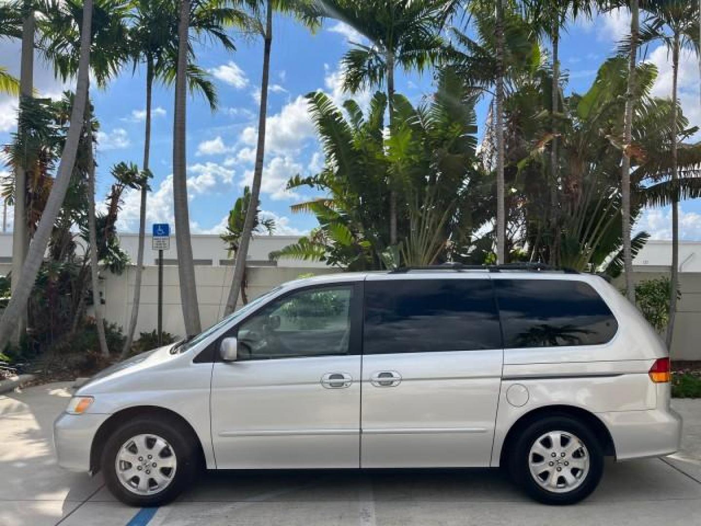 2002 Starlight Silver Metallic /Ivory Honda Odyssey 40 SERV EX LOW MILES 75,829 (2HKRL18612H) with an 3.5L SOHC MPFI 24-Valve VTEC V6 Engine engine, Automatic transmission, located at 4701 North Dixie Hwy, Pompano Beach, FL, 33064, (954) 422-2889, 26.240938, -80.123474 - OUR WEBPAGE FLORIDACARS1.COM HAS OVER 100 PHOTOS AND FREE CARFAX LINK 2002 HONDA ODYSSEY EX ROAD READY 3.5L V6 VIN: 2HKRL18612H522476 NO ACCIDENTS 25 MPG VAN LOW MILES 75,829 3.5L V6 F SOHC FLORIDA OWNER GASOLINE 3 ROW SEATS FRONT WHEEL DRIVE 40 SERVICE RECORDS POWER SLIDING DOORS 62,419 MILES Vehic - Photo#98