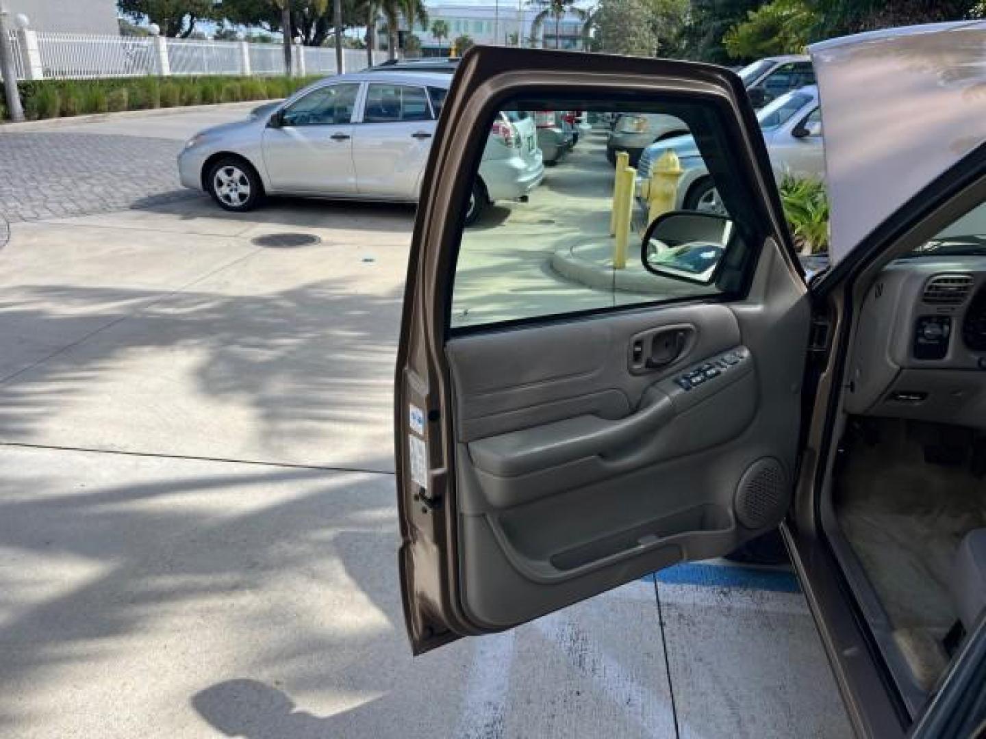 2004 Sandalwood Metallic /Medium Gray Chevrolet Blazer 4WD LS LOW MILES 85,272 (1GNDT13X54K) with an 4.3L Vortec 4300 V6 MFI Engine engine, Automatic transmission, located at 4701 North Dixie Hwy, Pompano Beach, FL, 33064, (954) 422-2889, 26.240938, -80.123474 - OUR WEBPAGE FLORIDACARS1.COM HAS OVER 100 PHOTOS AND FREE CARFAX LINK 2004 CHEVROLET BLAZER LS ROAD READY 4.3L V6 VIN: 1GNDT13X54K147505 NO ACCIDENTS 4 DOOR WAGON/SPORT UTILITY NO RECALLS 4X4 4.3L V6 F LOW MILES 85,272 GASOLINE 30 SERVICE RECORDS REAR WHEEL DRIVE W/ 4X4 4WD ON DEMAND 4WD Alloy Wheel - Photo#9