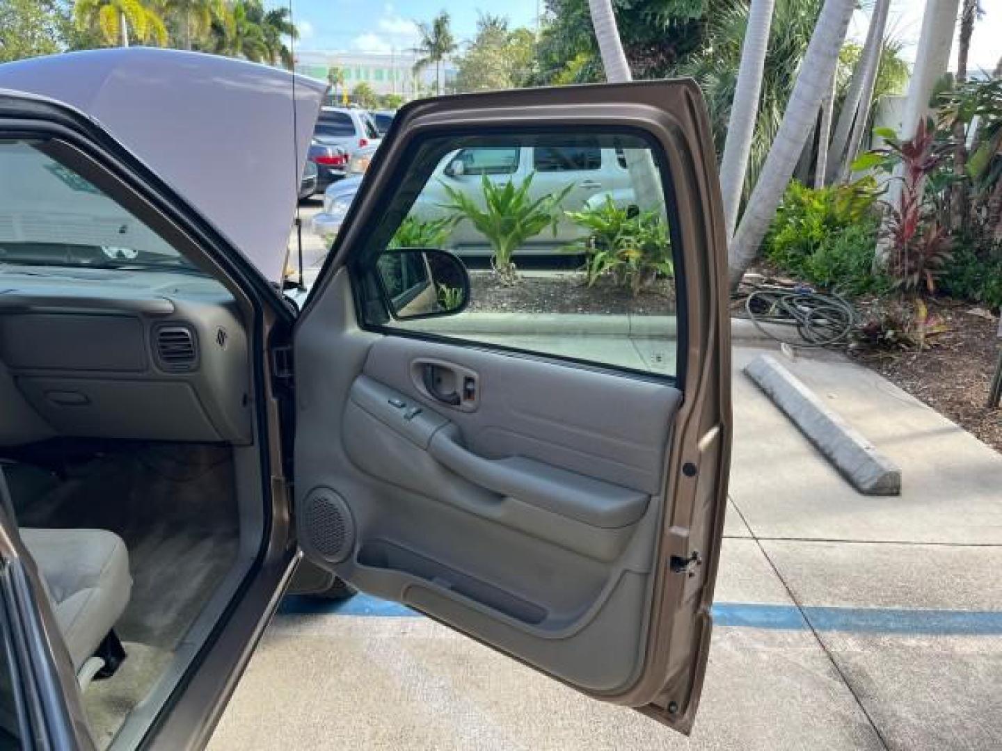 2004 Sandalwood Metallic /Medium Gray Chevrolet Blazer 4WD LS LOW MILES 85,272 (1GNDT13X54K) with an 4.3L Vortec 4300 V6 MFI Engine engine, Automatic transmission, located at 4701 North Dixie Hwy, Pompano Beach, FL, 33064, (954) 422-2889, 26.240938, -80.123474 - OUR WEBPAGE FLORIDACARS1.COM HAS OVER 100 PHOTOS AND FREE CARFAX LINK 2004 CHEVROLET BLAZER LS ROAD READY 4.3L V6 VIN: 1GNDT13X54K147505 NO ACCIDENTS 4 DOOR WAGON/SPORT UTILITY NO RECALLS 4X4 4.3L V6 F LOW MILES 85,272 GASOLINE 30 SERVICE RECORDS REAR WHEEL DRIVE W/ 4X4 4WD ON DEMAND 4WD Alloy Wheel - Photo#11