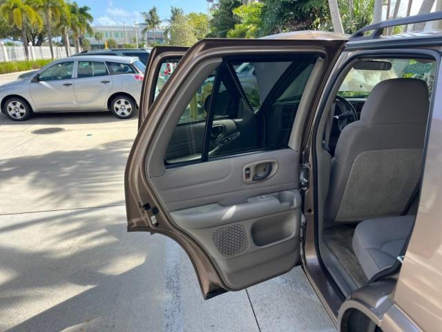 2004 Sandalwood Metallic /Medium Gray Chevrolet Blazer 4WD LS LOW MILES 85,272 (1GNDT13X54K) with an 4.3L Vortec 4300 V6 MFI Engine engine, Automatic transmission, located at 4701 North Dixie Hwy, Pompano Beach, FL, 33064, (954) 422-2889, 26.240938, -80.123474 - OUR WEBPAGE FLORIDACARS1.COM HAS OVER 100 PHOTOS AND FREE CARFAX LINK 2004 CHEVROLET BLAZER LS ROAD READY 4.3L V6 VIN: 1GNDT13X54K147505 NO ACCIDENTS 4 DOOR WAGON/SPORT UTILITY NO RECALLS 4X4 4.3L V6 F LOW MILES 85,272 GASOLINE 30 SERVICE RECORDS REAR WHEEL DRIVE W/ 4X4 4WD ON DEMAND 4WD Alloy Wheel - Photo#13