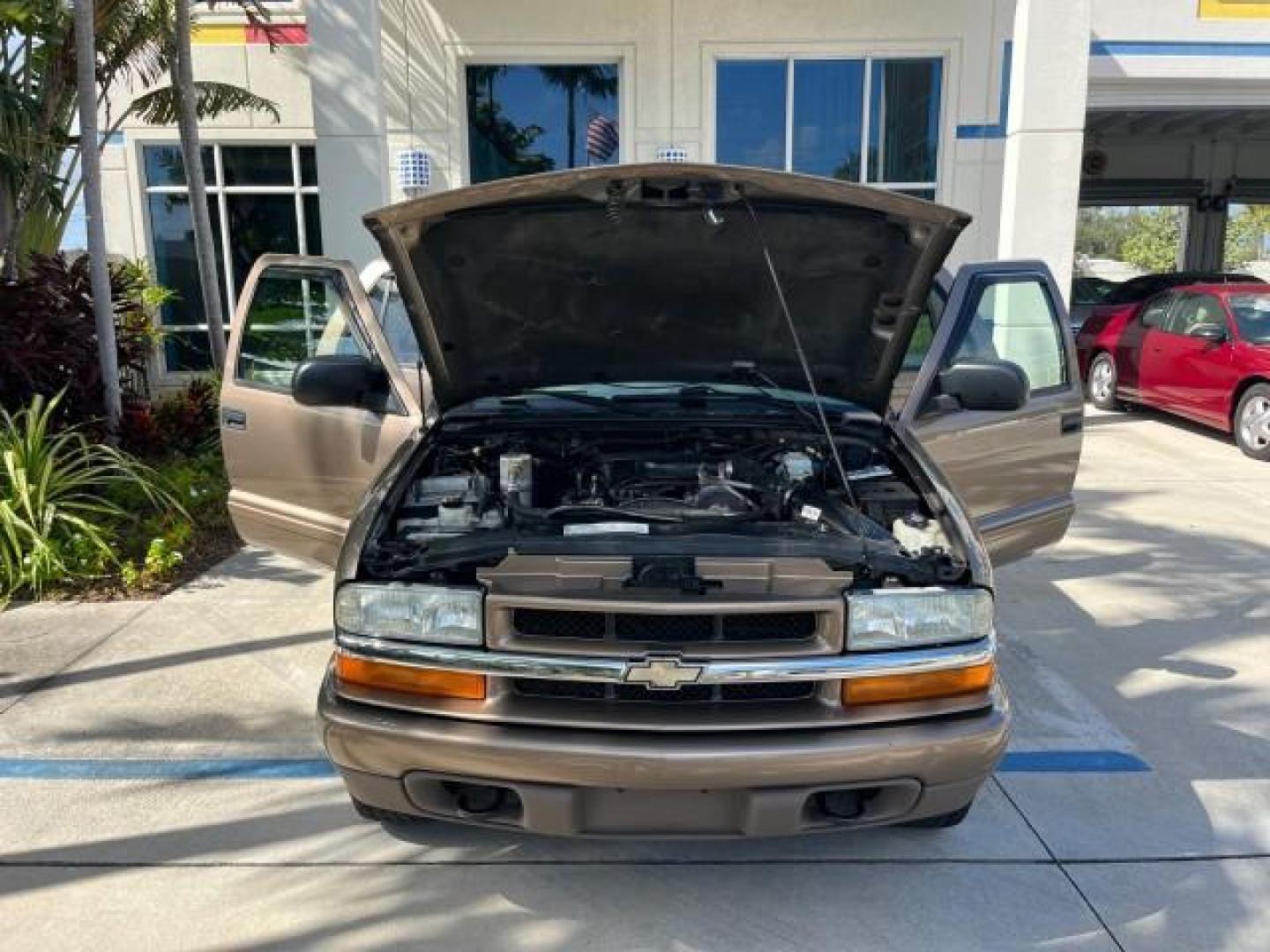 2004 Sandalwood Metallic /Medium Gray Chevrolet Blazer 4WD LS LOW MILES 85,272 (1GNDT13X54K) with an 4.3L Vortec 4300 V6 MFI Engine engine, Automatic transmission, located at 4701 North Dixie Hwy, Pompano Beach, FL, 33064, (954) 422-2889, 26.240938, -80.123474 - OUR WEBPAGE FLORIDACARS1.COM HAS OVER 100 PHOTOS AND FREE CARFAX LINK 2004 CHEVROLET BLAZER LS ROAD READY 4.3L V6 VIN: 1GNDT13X54K147505 NO ACCIDENTS 4 DOOR WAGON/SPORT UTILITY NO RECALLS 4X4 4.3L V6 F LOW MILES 85,272 GASOLINE 30 SERVICE RECORDS REAR WHEEL DRIVE W/ 4X4 4WD ON DEMAND 4WD Alloy Wheel - Photo#16