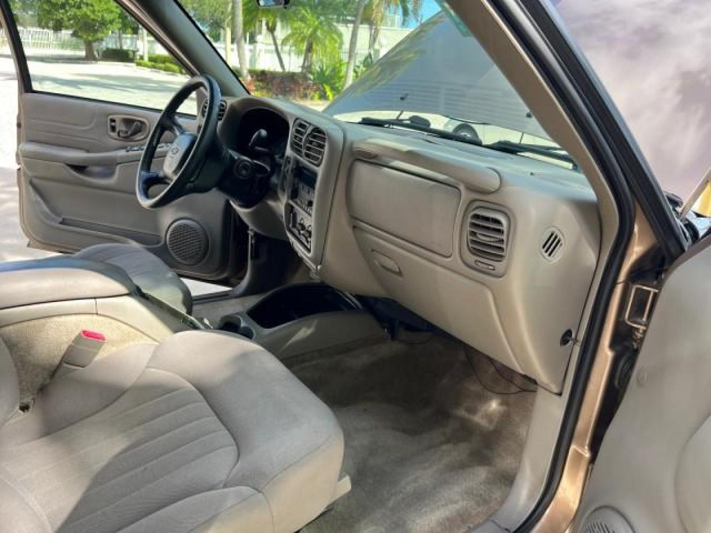 2004 Sandalwood Metallic /Medium Gray Chevrolet Blazer 4WD LS LOW MILES 85,272 (1GNDT13X54K) with an 4.3L Vortec 4300 V6 MFI Engine engine, Automatic transmission, located at 4701 North Dixie Hwy, Pompano Beach, FL, 33064, (954) 422-2889, 26.240938, -80.123474 - OUR WEBPAGE FLORIDACARS1.COM HAS OVER 100 PHOTOS AND FREE CARFAX LINK 2004 CHEVROLET BLAZER LS ROAD READY 4.3L V6 VIN: 1GNDT13X54K147505 NO ACCIDENTS 4 DOOR WAGON/SPORT UTILITY NO RECALLS 4X4 4.3L V6 F LOW MILES 85,272 GASOLINE 30 SERVICE RECORDS REAR WHEEL DRIVE W/ 4X4 4WD ON DEMAND 4WD Alloy Wheel - Photo#26