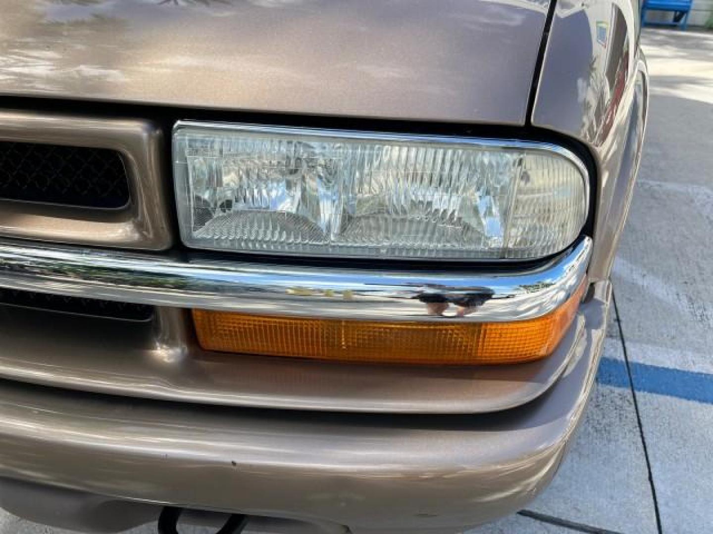 2004 Sandalwood Metallic /Medium Gray Chevrolet Blazer 4WD LS LOW MILES 85,272 (1GNDT13X54K) with an 4.3L Vortec 4300 V6 MFI Engine engine, Automatic transmission, located at 4701 North Dixie Hwy, Pompano Beach, FL, 33064, (954) 422-2889, 26.240938, -80.123474 - OUR WEBPAGE FLORIDACARS1.COM HAS OVER 100 PHOTOS AND FREE CARFAX LINK 2004 CHEVROLET BLAZER LS ROAD READY 4.3L V6 VIN: 1GNDT13X54K147505 NO ACCIDENTS 4 DOOR WAGON/SPORT UTILITY NO RECALLS 4X4 4.3L V6 F LOW MILES 85,272 GASOLINE 30 SERVICE RECORDS REAR WHEEL DRIVE W/ 4X4 4WD ON DEMAND 4WD Alloy Wheel - Photo#68