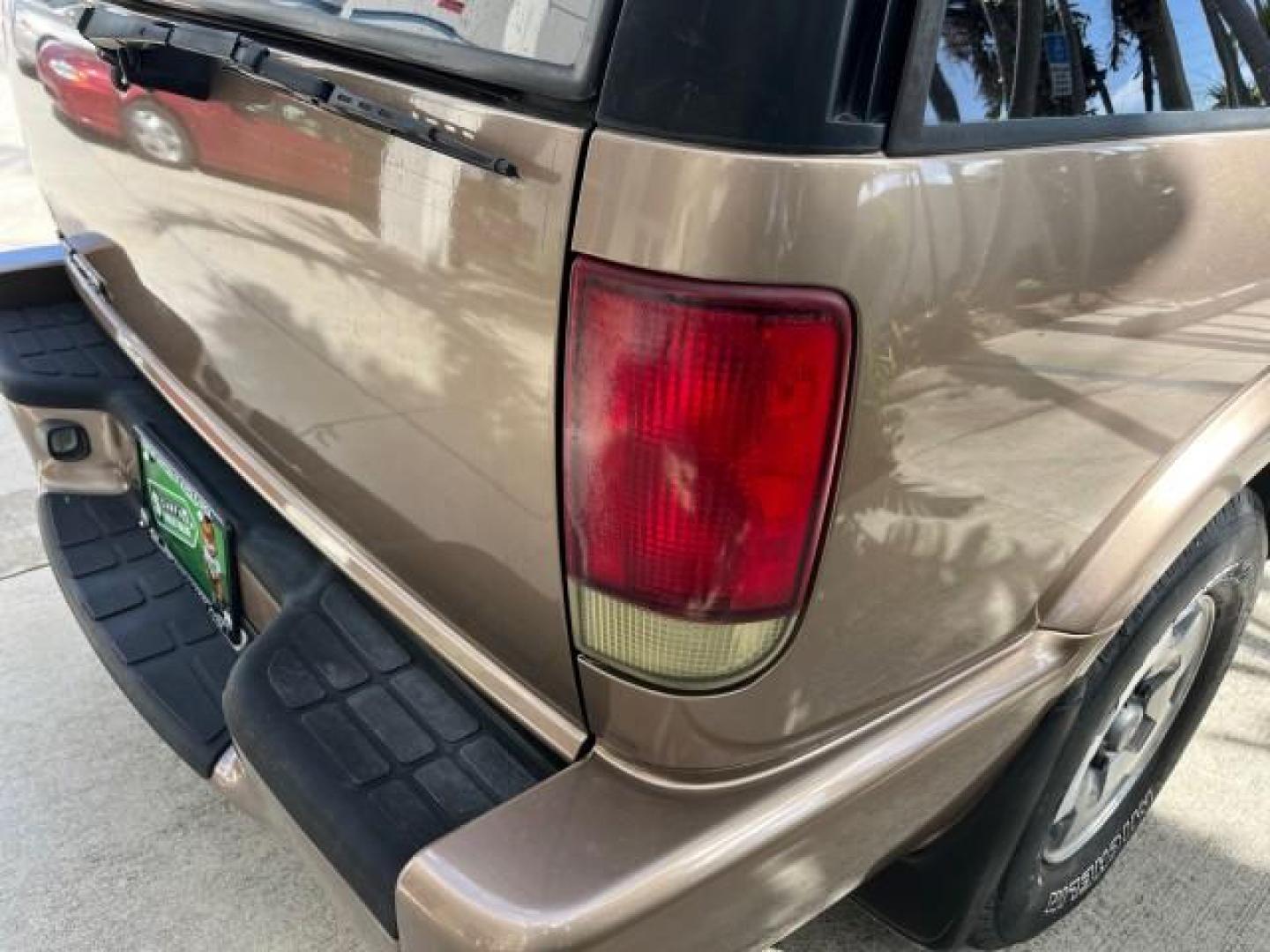 2004 Sandalwood Metallic /Medium Gray Chevrolet Blazer 4WD LS LOW MILES 85,272 (1GNDT13X54K) with an 4.3L Vortec 4300 V6 MFI Engine engine, Automatic transmission, located at 4701 North Dixie Hwy, Pompano Beach, FL, 33064, (954) 422-2889, 26.240938, -80.123474 - OUR WEBPAGE FLORIDACARS1.COM HAS OVER 100 PHOTOS AND FREE CARFAX LINK 2004 CHEVROLET BLAZER LS ROAD READY 4.3L V6 VIN: 1GNDT13X54K147505 NO ACCIDENTS 4 DOOR WAGON/SPORT UTILITY NO RECALLS 4X4 4.3L V6 F LOW MILES 85,272 GASOLINE 30 SERVICE RECORDS REAR WHEEL DRIVE W/ 4X4 4WD ON DEMAND 4WD Alloy Wheel - Photo#96