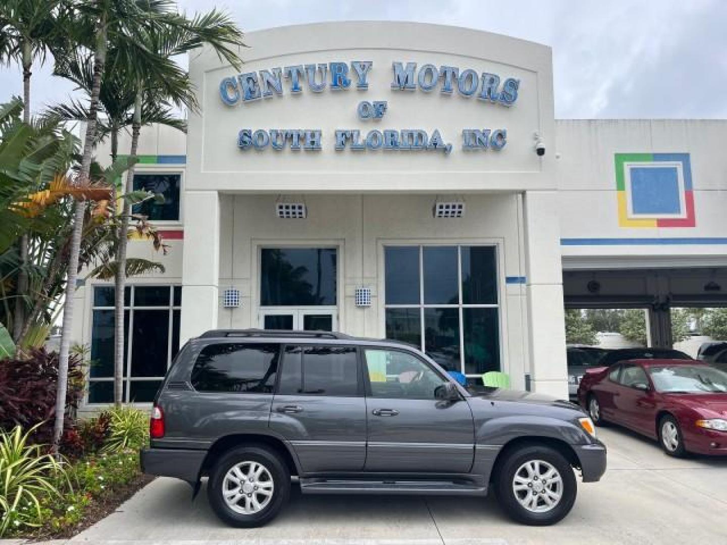 2004 Galactic Gray Mica /Gray Lexus LX 470 4WD LOW MILES 104,194 (JTJHT00W143) with an 4.7L DOHC SFI 32-Valve V8 Engine engine, Automatic transmission, located at 4701 North Dixie Hwy, Pompano Beach, FL, 33064, (954) 422-2889, 26.240938, -80.123474 - 2004 LEXUS LX 470 NEW $70,128 ROAD READY 4.7L V8 VIN: JTJHT00W143540859 NO ACCIDENTS NO RECALLS 4 DOOR WAGON/SPORT UTILITY FLORIDA OWNER LOW MILES 104,194 4.7L V8 F 32V 3 ROW SEATS ARE INCLUDED 19 SERVICE RECORDS AWD GASOLINE ALL WHEEL DRIVE POWER HEATED LEATHER SEATS ALL WHEEL DRIVE BACK UP CAMERA - Photo#0