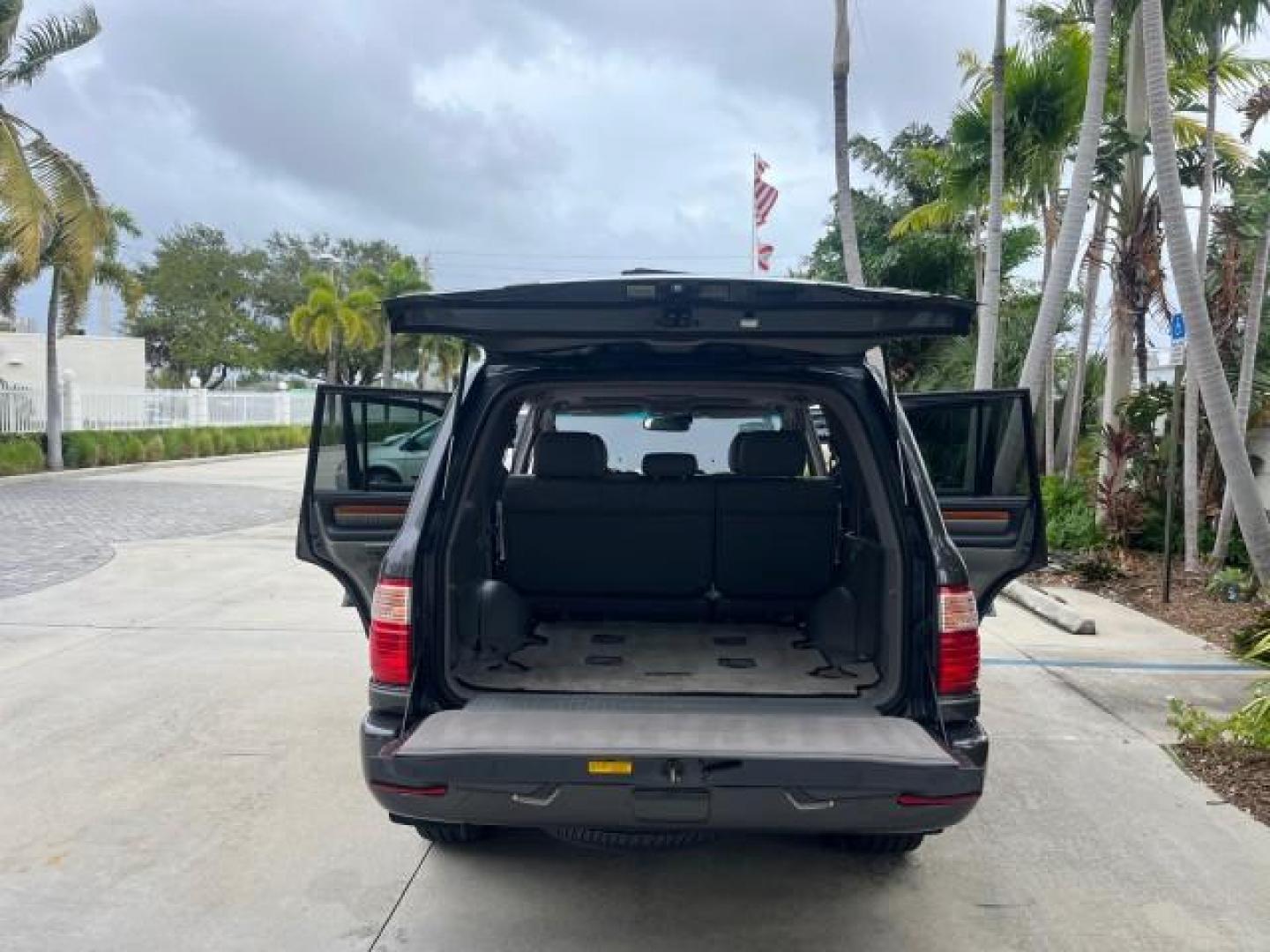 2004 Galactic Gray Mica /Gray Lexus LX 470 4WD LOW MILES 104,194 (JTJHT00W143) with an 4.7L DOHC SFI 32-Valve V8 Engine engine, Automatic transmission, located at 4701 North Dixie Hwy, Pompano Beach, FL, 33064, (954) 422-2889, 26.240938, -80.123474 - 2004 LEXUS LX 470 NEW $70,128 ROAD READY 4.7L V8 VIN: JTJHT00W143540859 NO ACCIDENTS NO RECALLS 4 DOOR WAGON/SPORT UTILITY FLORIDA OWNER LOW MILES 104,194 4.7L V8 F 32V 3 ROW SEATS ARE INCLUDED 19 SERVICE RECORDS AWD GASOLINE ALL WHEEL DRIVE POWER HEATED LEATHER SEATS ALL WHEEL DRIVE BACK UP CAMERA - Photo#15