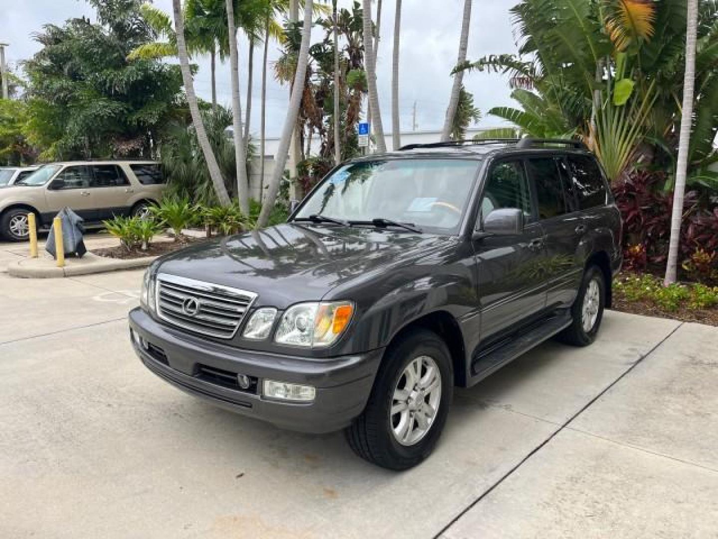 2004 Galactic Gray Mica /Gray Lexus LX 470 4WD LOW MILES 104,194 (JTJHT00W143) with an 4.7L DOHC SFI 32-Valve V8 Engine engine, Automatic transmission, located at 4701 North Dixie Hwy, Pompano Beach, FL, 33064, (954) 422-2889, 26.240938, -80.123474 - 2004 LEXUS LX 470 NEW $70,128 ROAD READY 4.7L V8 VIN: JTJHT00W143540859 NO ACCIDENTS NO RECALLS 4 DOOR WAGON/SPORT UTILITY FLORIDA OWNER LOW MILES 104,194 4.7L V8 F 32V 3 ROW SEATS ARE INCLUDED 19 SERVICE RECORDS AWD GASOLINE ALL WHEEL DRIVE POWER HEATED LEATHER SEATS ALL WHEEL DRIVE BACK UP CAMERA - Photo#3