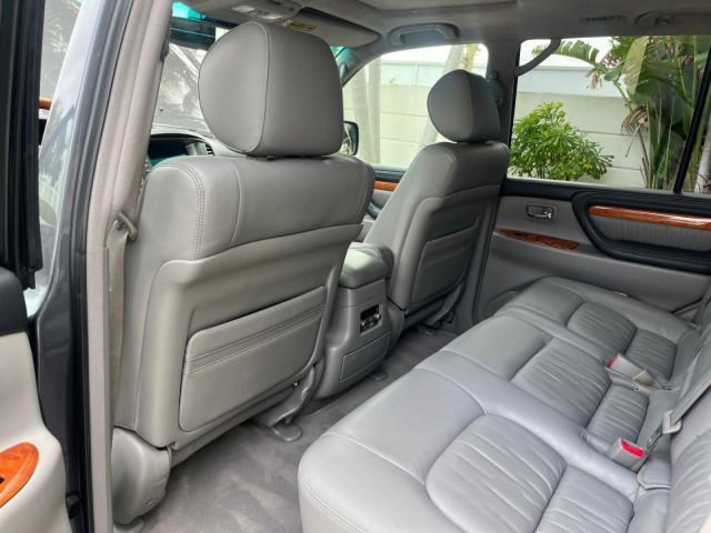 2004 Galactic Gray Mica /Gray Lexus LX 470 4WD LOW MILES 104,194 (JTJHT00W143) with an 4.7L DOHC SFI 32-Valve V8 Engine engine, Automatic transmission, located at 4701 North Dixie Hwy, Pompano Beach, FL, 33064, (954) 422-2889, 26.240938, -80.123474 - 2004 LEXUS LX 470 NEW $70,128 ROAD READY 4.7L V8 VIN: JTJHT00W143540859 NO ACCIDENTS NO RECALLS 4 DOOR WAGON/SPORT UTILITY FLORIDA OWNER LOW MILES 104,194 4.7L V8 F 32V 3 ROW SEATS ARE INCLUDED 19 SERVICE RECORDS AWD GASOLINE ALL WHEEL DRIVE POWER HEATED LEATHER SEATS ALL WHEEL DRIVE BACK UP CAMERA - Photo#39