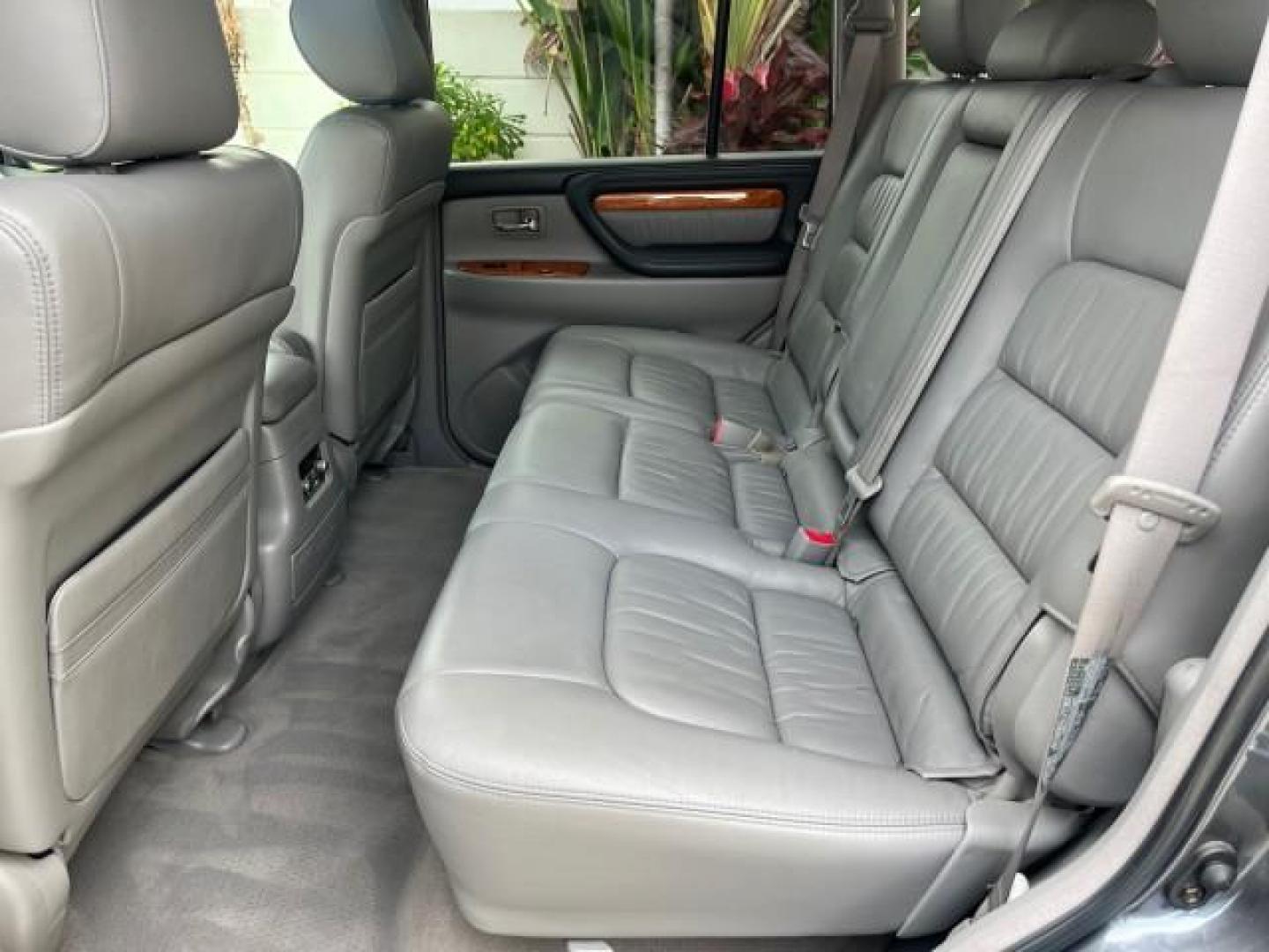 2004 Galactic Gray Mica /Gray Lexus LX 470 4WD LOW MILES 104,194 (JTJHT00W143) with an 4.7L DOHC SFI 32-Valve V8 Engine engine, Automatic transmission, located at 4701 North Dixie Hwy, Pompano Beach, FL, 33064, (954) 422-2889, 26.240938, -80.123474 - 2004 LEXUS LX 470 NEW $70,128 ROAD READY 4.7L V8 VIN: JTJHT00W143540859 NO ACCIDENTS NO RECALLS 4 DOOR WAGON/SPORT UTILITY FLORIDA OWNER LOW MILES 104,194 4.7L V8 F 32V 3 ROW SEATS ARE INCLUDED 19 SERVICE RECORDS AWD GASOLINE ALL WHEEL DRIVE POWER HEATED LEATHER SEATS ALL WHEEL DRIVE BACK UP CAMERA - Photo#40