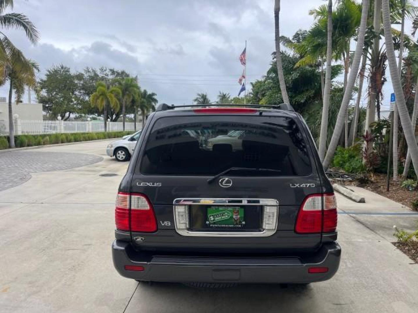 2004 Galactic Gray Mica /Gray Lexus LX 470 4WD LOW MILES 104,194 (JTJHT00W143) with an 4.7L DOHC SFI 32-Valve V8 Engine engine, Automatic transmission, located at 4701 North Dixie Hwy, Pompano Beach, FL, 33064, (954) 422-2889, 26.240938, -80.123474 - 2004 LEXUS LX 470 NEW $70,128 ROAD READY 4.7L V8 VIN: JTJHT00W143540859 NO ACCIDENTS NO RECALLS 4 DOOR WAGON/SPORT UTILITY FLORIDA OWNER LOW MILES 104,194 4.7L V8 F 32V 3 ROW SEATS ARE INCLUDED 19 SERVICE RECORDS AWD GASOLINE ALL WHEEL DRIVE POWER HEATED LEATHER SEATS ALL WHEEL DRIVE BACK UP CAMERA - Photo#6