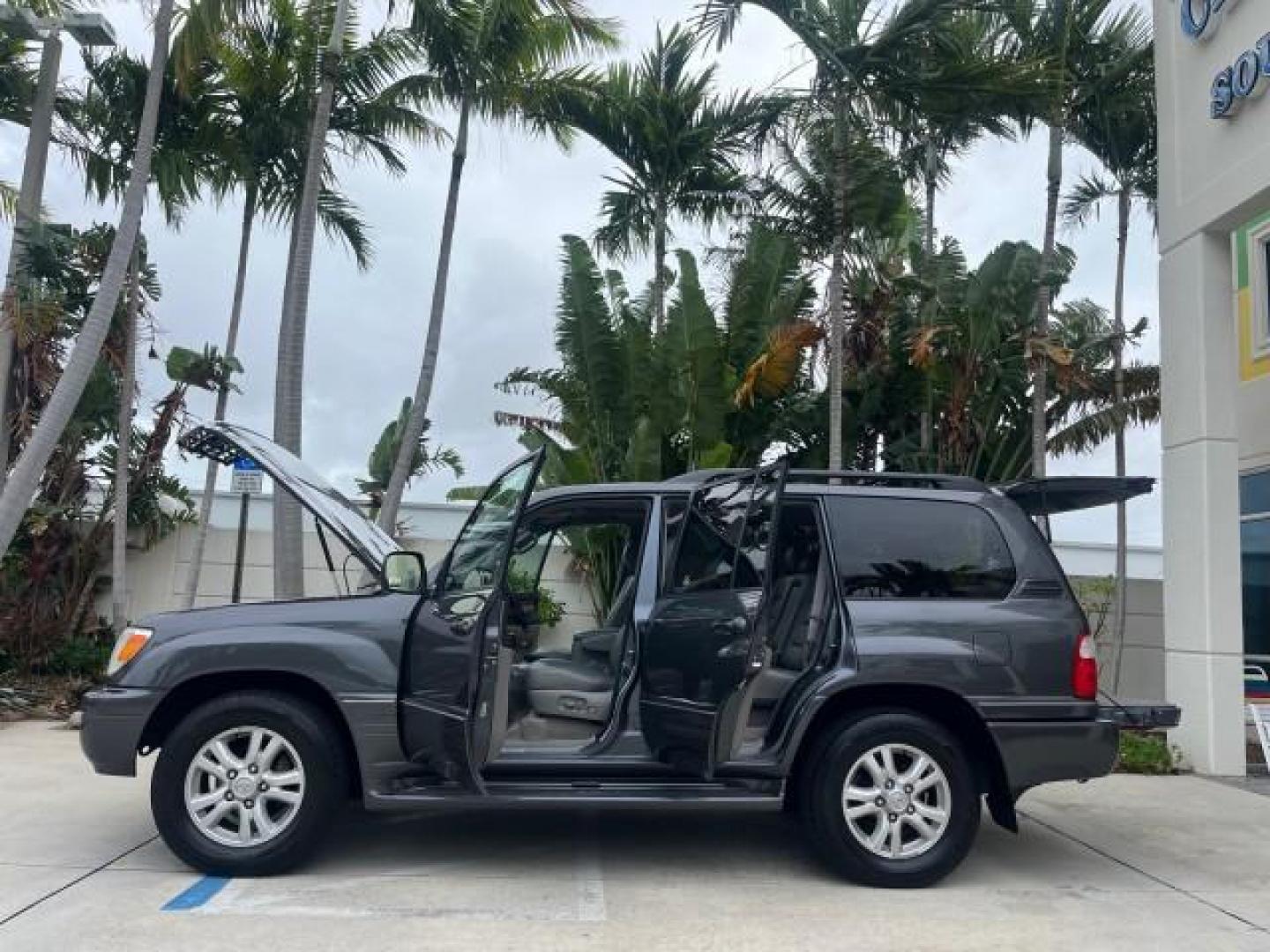 2004 Galactic Gray Mica /Gray Lexus LX 470 4WD LOW MILES 104,194 (JTJHT00W143) with an 4.7L DOHC SFI 32-Valve V8 Engine engine, Automatic transmission, located at 4701 North Dixie Hwy, Pompano Beach, FL, 33064, (954) 422-2889, 26.240938, -80.123474 - 2004 LEXUS LX 470 NEW $70,128 ROAD READY 4.7L V8 VIN: JTJHT00W143540859 NO ACCIDENTS NO RECALLS 4 DOOR WAGON/SPORT UTILITY FLORIDA OWNER LOW MILES 104,194 4.7L V8 F 32V 3 ROW SEATS ARE INCLUDED 19 SERVICE RECORDS AWD GASOLINE ALL WHEEL DRIVE POWER HEATED LEATHER SEATS ALL WHEEL DRIVE BACK UP CAMERA - Photo#8