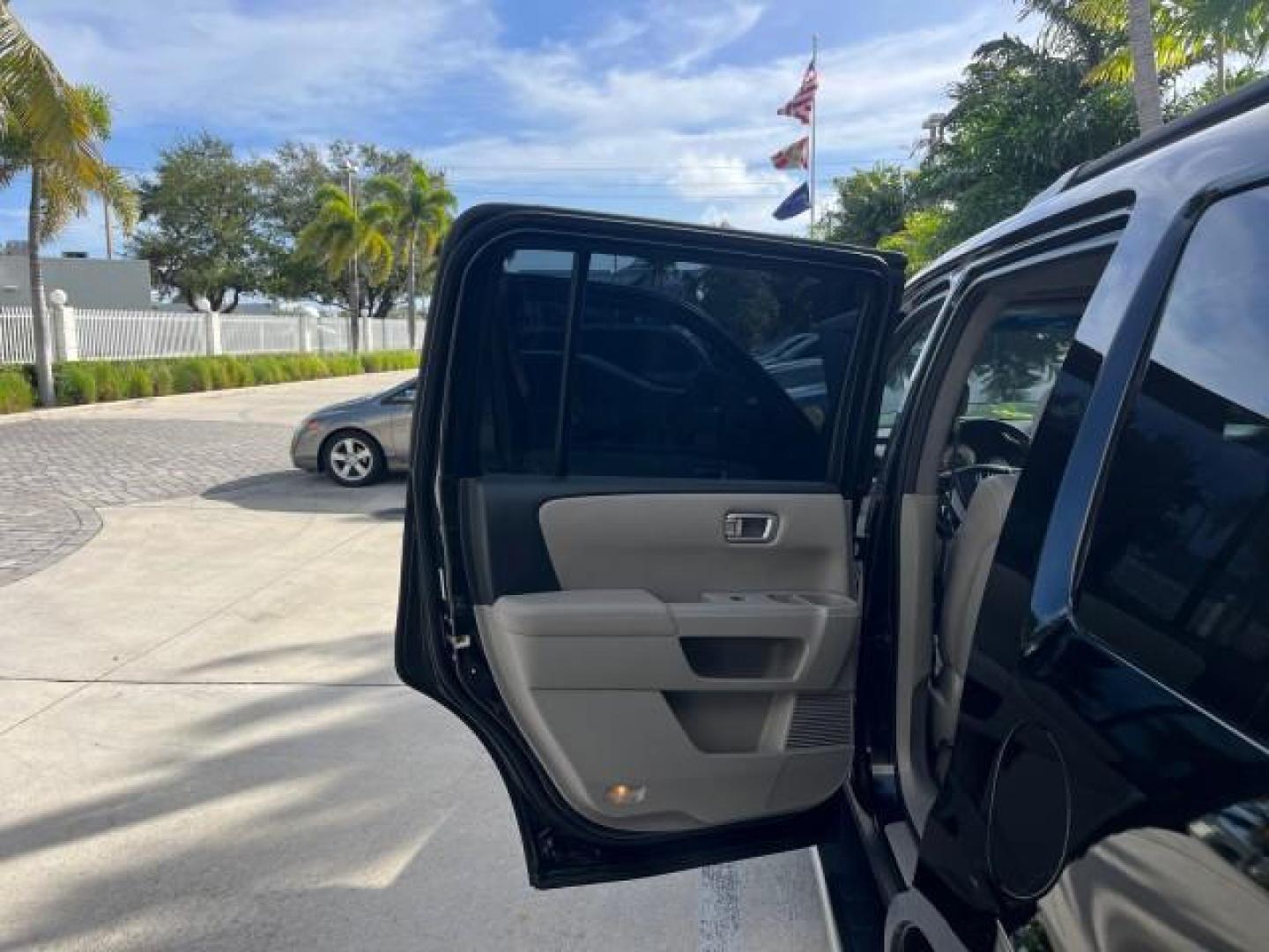 2011 Crystal Black Pearl /Gray Honda Pilot 1 FL EX-L LOW MILES 58,977 (5FNYF3H55BB) with an 3.5L SOHC MPFI 24-Valve i-VTEC V6 Engine engine, Automatic transmission, located at 4701 North Dixie Hwy, Pompano Beach, FL, 33064, (954) 422-2889, 26.240938, -80.123474 - OUR WEBPAGE FLORIDACARS1.COM HAS OVER 100 PHOTOS AND FREE CARFAX LINK 2011 HONDA PILOT EX-L ROAD READY 3.5L V6 VIN: 5FNYF3H55BB047158 NO ACCIDENTS NO RECALLS 4 DOOR WAGON/SPORT UTILITY 1 OWNER FLORIDA 3.5L V6 F SOHC 24V DUAL AC LOW MILES 58,977 GASOLINE 3 ROW SEATS POWER LEATHER SEATS FRONT WHEEL DR - Photo#28