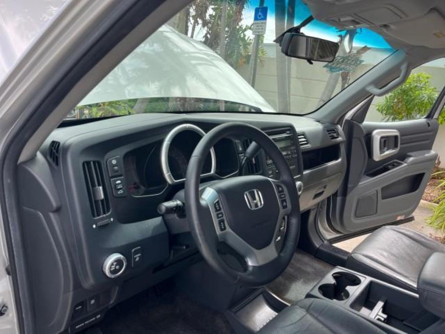 2007 Billet Silver Metallic /Gray Honda Ridgeline 1 OWNER RTL w/Leather LOW MILES 90,340 (2HJYK16587H) with an 3.5L SOHC PGM-FI 24-Valve VTEC V6 Engine engine, Automatic transmission, located at 4701 North Dixie Hwy, Pompano Beach, FL, 33064, (954) 422-2889, 26.240938, -80.123474 - OUR WEBPAGE FLORIDACARS1.COM HAS OVER 100 PHOTOS AND FREE CARFAX LINK 2007 HONDA RIDGELINE RTL ROAD READY 3.5L V6 VIN: 2HJYK16587H550716 NO ACCIDENTS SUNROOF CREW PICKUP NO RECALLS 4X4 3.5L V6 F SOHC 24V 1 OWNER FLORIDA GASOLINE AWD LOW MILES 90,340 FRONT WHEEL DRIVE W/ 4X4 5.0 FT BED POWER LEATHER - Photo#10