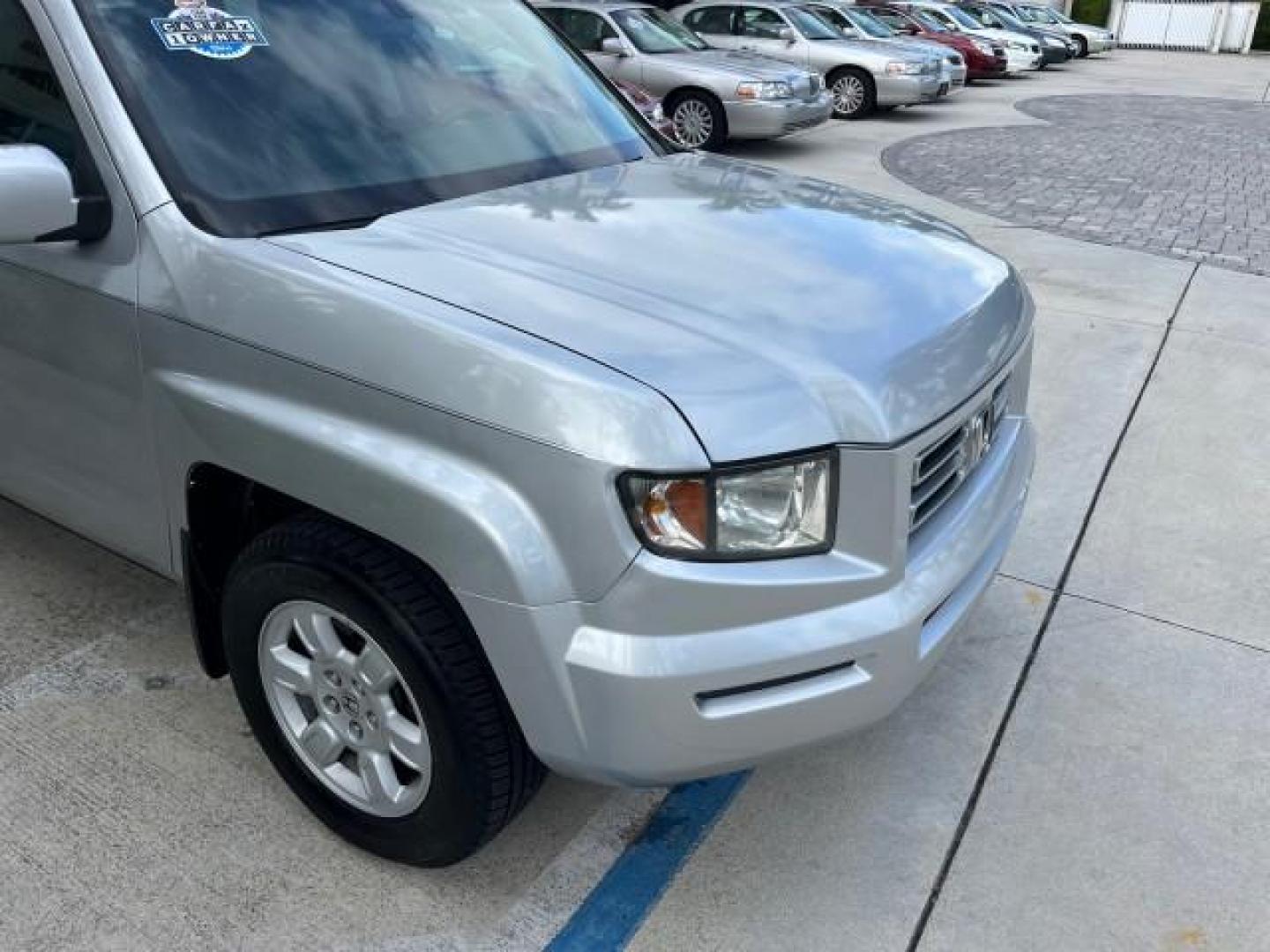 2007 Billet Silver Metallic /Gray Honda Ridgeline 1 OWNER RTL w/Leather LOW MILES 90,340 (2HJYK16587H) with an 3.5L SOHC PGM-FI 24-Valve VTEC V6 Engine engine, Automatic transmission, located at 4701 North Dixie Hwy, Pompano Beach, FL, 33064, (954) 422-2889, 26.240938, -80.123474 - OUR WEBPAGE FLORIDACARS1.COM HAS OVER 100 PHOTOS AND FREE CARFAX LINK 2007 HONDA RIDGELINE RTL ROAD READY 3.5L V6 VIN: 2HJYK16587H550716 NO ACCIDENTS SUNROOF CREW PICKUP NO RECALLS 4X4 3.5L V6 F SOHC 24V 1 OWNER FLORIDA GASOLINE AWD LOW MILES 90,340 FRONT WHEEL DRIVE W/ 4X4 5.0 FT BED POWER LEATHER - Photo#77