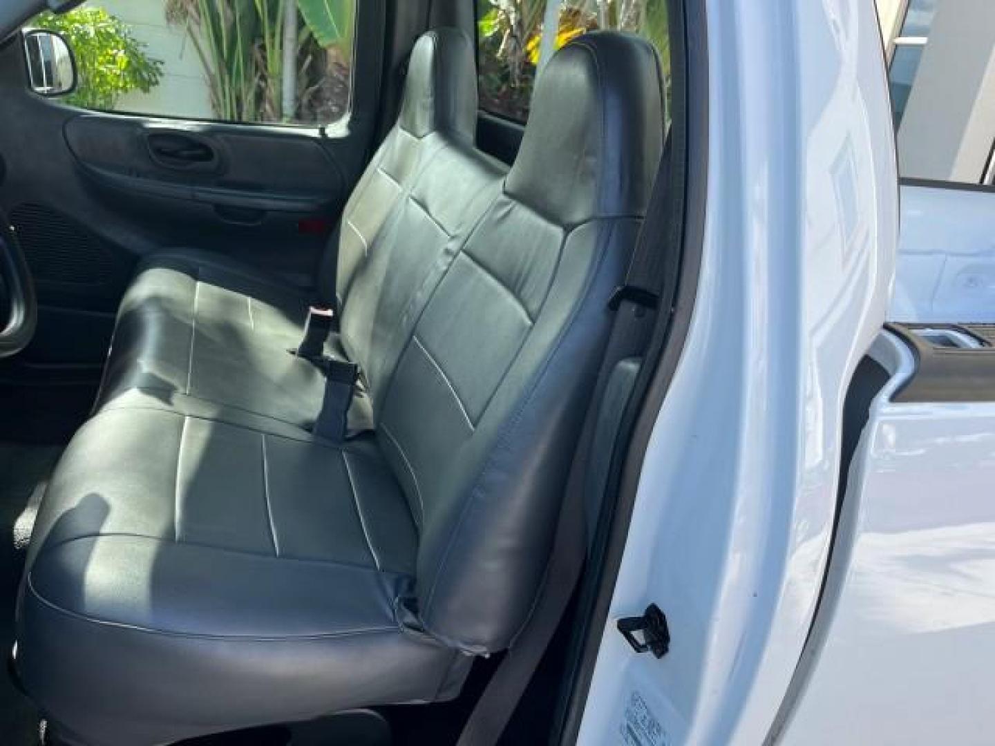 2003 Oxford White /Dark Graphite Ford F-150 1 FL XL LOW MILES 27,907 (2FTRF17L33C) with an 5.4L 8-Cyl Engine engine, Automatic transmission, located at 4701 North Dixie Hwy, Pompano Beach, FL, 33064, (954) 422-2889, 26.240938, -80.123474 - OUR WEBPAGE FLORIDACARS1.COM HAS OVER 100 PHOTOS AND FREE CARFAX LINK 2003 FORD F-150 XL LONG BED ROAD READY WORK READY VIN: 2FTRF17L33CA75039 NO ACCIDENTS 5.4L V8 PICKUP NO RECALLS 8.1FT BED 5.4L V8 F SOHC 16V 1 OWNER FLORIDA GASOLINE SUPER LOW MILES 27,907 REAR WHEEL DRIVE 18 SERVICE RECORDS Appro - Photo#13