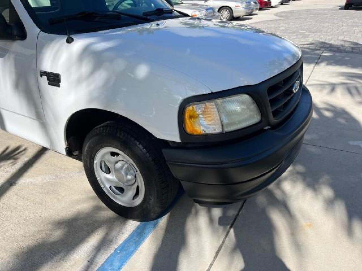 2003 Oxford White /Dark Graphite Ford F-150 1 FL XL LOW MILES 27,907 (2FTRF17L33C) with an 5.4L 8-Cyl Engine engine, Automatic transmission, located at 4701 North Dixie Hwy, Pompano Beach, FL, 33064, (954) 422-2889, 26.240938, -80.123474 - OUR WEBPAGE FLORIDACARS1.COM HAS OVER 100 PHOTOS AND FREE CARFAX LINK 2003 FORD F-150 XL LONG BED ROAD READY WORK READY VIN: 2FTRF17L33CA75039 NO ACCIDENTS 5.4L V8 PICKUP NO RECALLS 8.1FT BED 5.4L V8 F SOHC 16V 1 OWNER FLORIDA GASOLINE SUPER LOW MILES 27,907 REAR WHEEL DRIVE 18 SERVICE RECORDS Appro - Photo#73