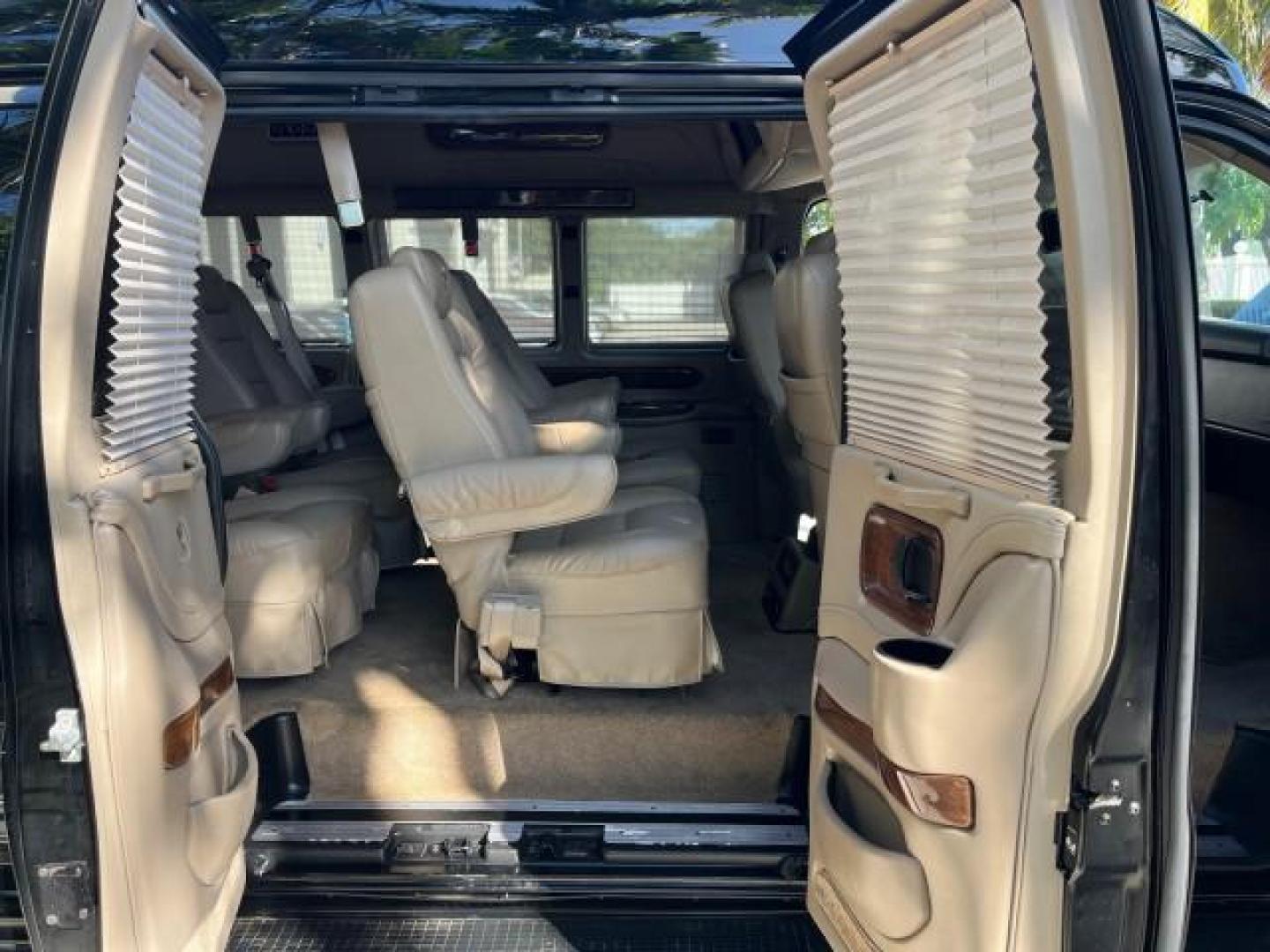 2010 Onyx Black /Neutral GMC Savana Cargo Van HI TOP CONV VAN EXT LOW MILES 26,447 (1GDZGNBG1A1) with an 6.0L Vortec 1000 V8 SFI Flex-Fuel Engine engine, Automatic transmission, located at 4701 North Dixie Hwy, Pompano Beach, FL, 33064, (954) 422-2889, 26.240938, -80.123474 - OUR WEBPAGE FLORIDACARS1.COM HAS OVER 100 PHOTOS AND FREE CARFAX LINK 2010 GMC SAVANA 2500 EXT ROAD READY 6.0L V8 VIN: 1GDZGNBG1A1179957 17 SERVICE RECORDS NO ACCIDENTS VAN $100,000 CONVERSION NO RECALLS 6.0L V8 F OHV 16V 3 ROW POWER SEATS 1 OWNER NAVIGATION FLEX FUEL TV DVD SUPER LOW MILES 26,447 R - Photo#13