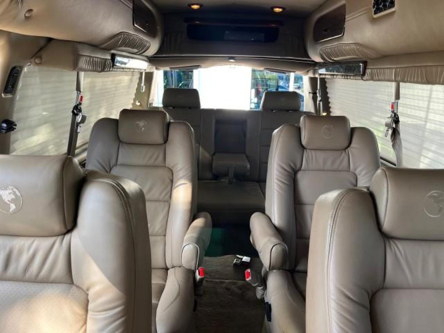 2010 Onyx Black /Neutral GMC Savana Cargo Van HI TOP CONV VAN EXT LOW MILES 26,447 (1GDZGNBG1A1) with an 6.0L Vortec 1000 V8 SFI Flex-Fuel Engine engine, Automatic transmission, located at 4701 North Dixie Hwy, Pompano Beach, FL, 33064, (954) 422-2889, 26.240938, -80.123474 - OUR WEBPAGE FLORIDACARS1.COM HAS OVER 100 PHOTOS AND FREE CARFAX LINK 2010 GMC SAVANA 2500 EXT ROAD READY 6.0L V8 VIN: 1GDZGNBG1A1179957 17 SERVICE RECORDS NO ACCIDENTS VAN $100,000 CONVERSION NO RECALLS 6.0L V8 F OHV 16V 3 ROW POWER SEATS 1 OWNER NAVIGATION FLEX FUEL TV DVD SUPER LOW MILES 26,447 R - Photo#14