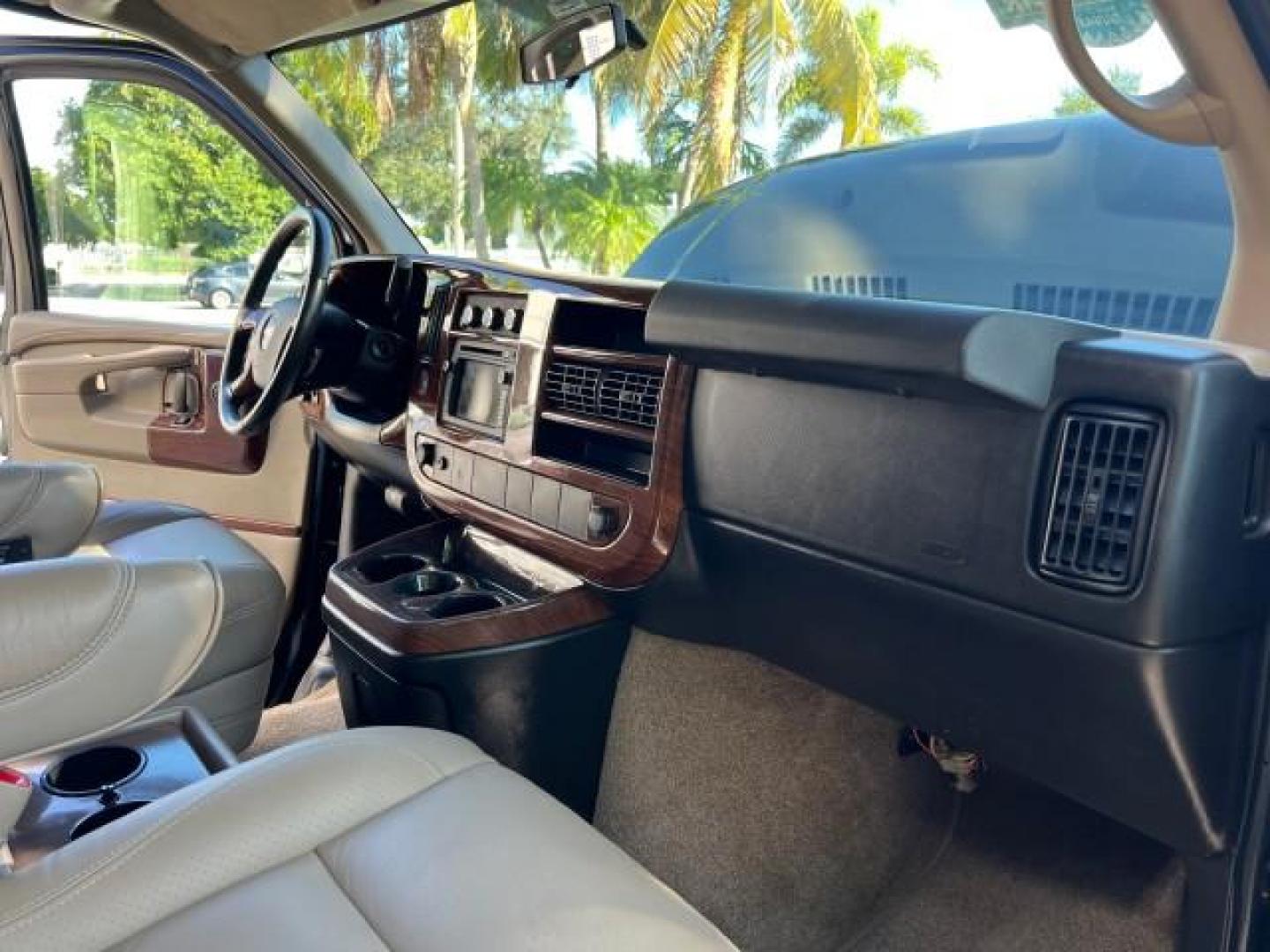 2010 Onyx Black /Neutral GMC Savana Cargo Van HI TOP CONV VAN EXT LOW MILES 26,447 (1GDZGNBG1A1) with an 6.0L Vortec 1000 V8 SFI Flex-Fuel Engine engine, Automatic transmission, located at 4701 North Dixie Hwy, Pompano Beach, FL, 33064, (954) 422-2889, 26.240938, -80.123474 - OUR WEBPAGE FLORIDACARS1.COM HAS OVER 100 PHOTOS AND FREE CARFAX LINK 2010 GMC SAVANA 2500 EXT ROAD READY 6.0L V8 VIN: 1GDZGNBG1A1179957 17 SERVICE RECORDS NO ACCIDENTS VAN $100,000 CONVERSION NO RECALLS 6.0L V8 F OHV 16V 3 ROW POWER SEATS 1 OWNER NAVIGATION FLEX FUEL TV DVD SUPER LOW MILES 26,447 R - Photo#29