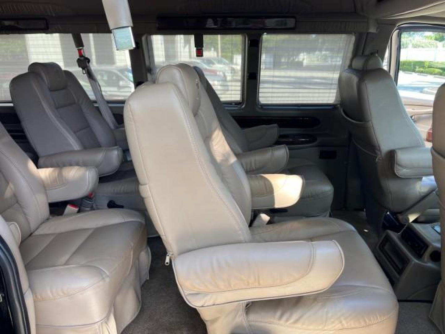 2010 Onyx Black /Neutral GMC Savana Cargo Van HI TOP CONV VAN EXT LOW MILES 26,447 (1GDZGNBG1A1) with an 6.0L Vortec 1000 V8 SFI Flex-Fuel Engine engine, Automatic transmission, located at 4701 North Dixie Hwy, Pompano Beach, FL, 33064, (954) 422-2889, 26.240938, -80.123474 - OUR WEBPAGE FLORIDACARS1.COM HAS OVER 100 PHOTOS AND FREE CARFAX LINK 2010 GMC SAVANA 2500 EXT ROAD READY 6.0L V8 VIN: 1GDZGNBG1A1179957 17 SERVICE RECORDS NO ACCIDENTS VAN $100,000 CONVERSION NO RECALLS 6.0L V8 F OHV 16V 3 ROW POWER SEATS 1 OWNER NAVIGATION FLEX FUEL TV DVD SUPER LOW MILES 26,447 R - Photo#37