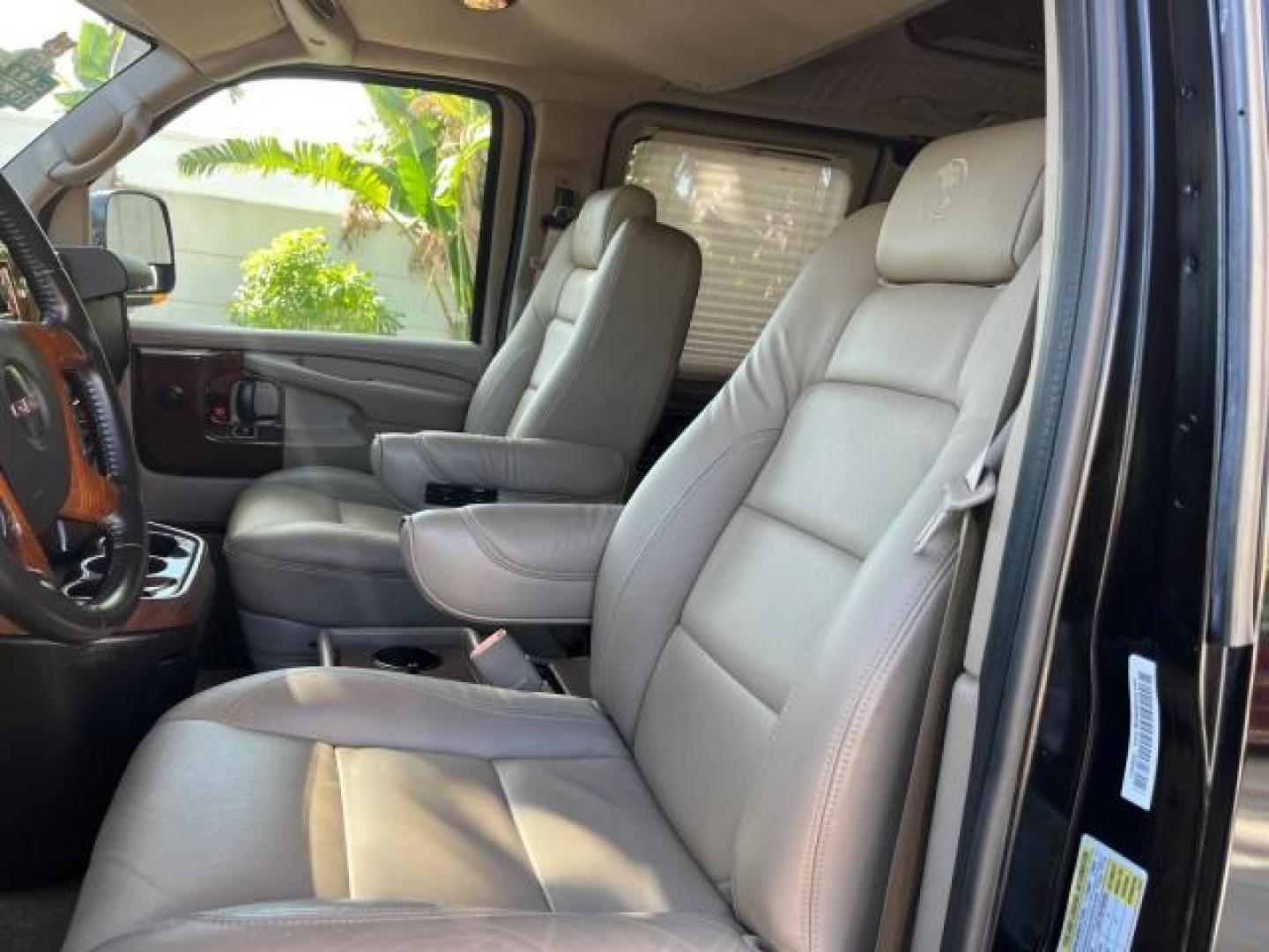 2010 Onyx Black /Neutral GMC Savana Cargo Van HI TOP CONV VAN EXT LOW MILES 26,447 (1GDZGNBG1A1) with an 6.0L Vortec 1000 V8 SFI Flex-Fuel Engine engine, Automatic transmission, located at 4701 North Dixie Hwy, Pompano Beach, FL, 33064, (954) 422-2889, 26.240938, -80.123474 - OUR WEBPAGE FLORIDACARS1.COM HAS OVER 100 PHOTOS AND FREE CARFAX LINK 2010 GMC SAVANA 2500 EXT ROAD READY 6.0L V8 VIN: 1GDZGNBG1A1179957 17 SERVICE RECORDS NO ACCIDENTS VAN $100,000 CONVERSION NO RECALLS 6.0L V8 F OHV 16V 3 ROW POWER SEATS 1 OWNER NAVIGATION FLEX FUEL TV DVD SUPER LOW MILES 26,447 R - Photo#76