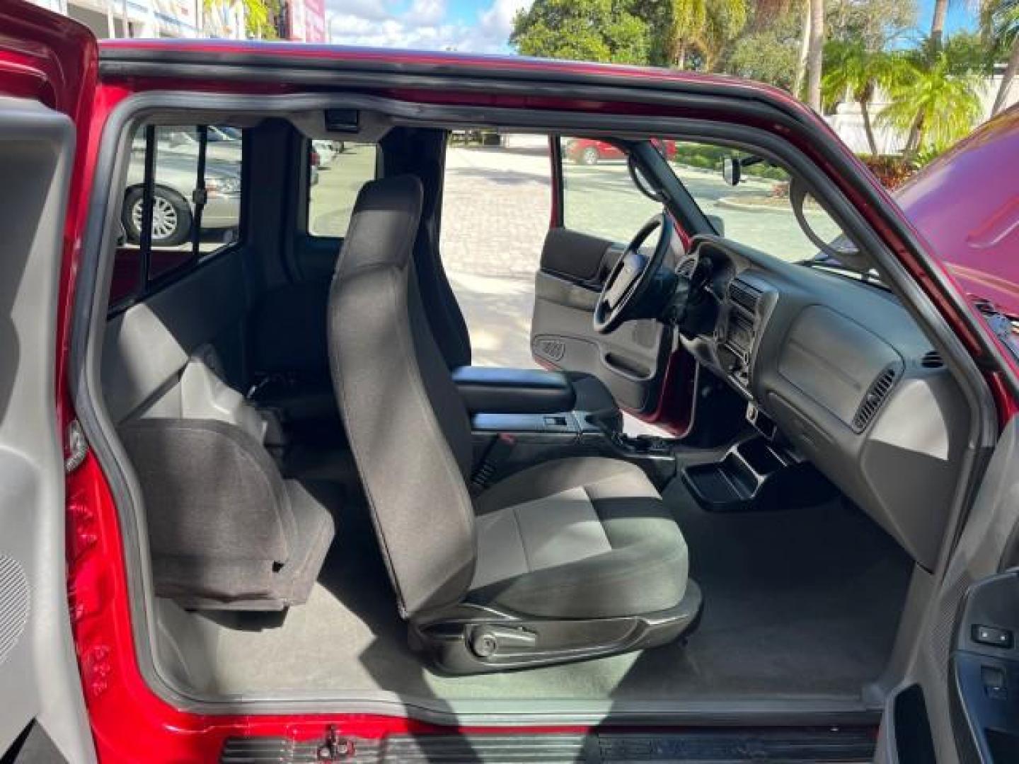 2008 Redfire Metallic /Medium Dk Flint Ford Ranger XLT SUPER CAB LOW MILES 44,681 (1FTYR44U78P) with an 3.0L OHV V6 Engine engine, Automatic transmission, located at 4701 North Dixie Hwy, Pompano Beach, FL, 33064, (954) 422-2889, 26.240938, -80.123474 - OUR WEBPAGE FLORIDACARS1.COM HAS OVER 100 PHOTOS AND FREE CARFAX LINK 2008 FORD RANGER SPORT ROAD READY WORK READY VIN: 1FTYR44U78PB16831 LOW MILES 44,681 4 DOOR EXTENDED CAB PICKUP NO ACCIDENTS 3.0L V6 3.0L V6 F NO RECALLS 6,1 FT BED GASOLINE 16 SERVICE RECORDS REAR WHEEL DRIVE POWER MIRRORS XLT 4X - Photo#12