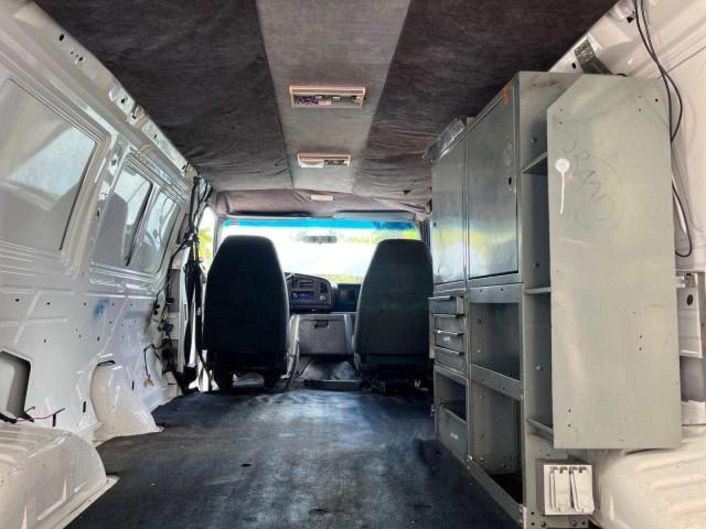 1994 WHITE /GREY Ford Econoline Cargo Van 350 EXT 1 FL LOW MILES 32,200 (1FTJS34H1RH) with an 5.8L EFI V8 Engine engine, Automatic transmission, located at 4701 North Dixie Hwy, Pompano Beach, FL, 33064, (954) 422-2889, 26.240938, -80.123474 - OUR WEBPAGE FLORIDACARS1.COM HAS OVER 100 PHOTOS AND FREE CARFAX LINK 1994 FORD E-350 SUPER EXT ROAD READY WORK READY VIN: 1FTJS34H1RHB36720 NO RECALLS 5.8L V8 VAN SUPER LOW MILES 32,200 5.8L V8 F 1 OWNER FLORIDA GASOLINE 5 SERVICE RECORDS REAR WHEEL DRIVE THIS IS ONE OF THE NICEST FORD S WE HAVE EV - Photo#42