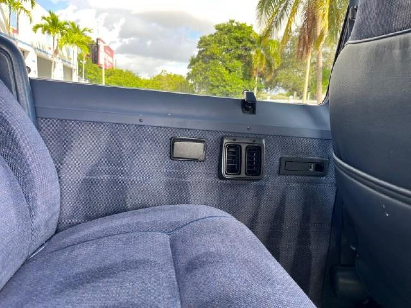 1995 BLUE /BLUE Dodge Ram Wagon EXT 15 PAS LOW MILES 69,523 (2B5WB35Z6SK) with an 5.9L MPI V8 Magnum Engine engine, Automatic transmission, located at 4701 North Dixie Hwy, Pompano Beach, FL, 33064, (954) 422-2889, 26.240938, -80.123474 - OUR WEBPAGE FLORIDACARS1.COM HAS OVER 100 PHOTOS AND FREE CARFAX LINK 1995 DODGE RAM VAN 3500 ROAD READY 5.9L V8 VIN: 2B5WB35Z6SK538547 NO ACCIDENTS VAN 15 PASSANGER 5.9L V8 F OHV 16V 4 ROW SEATS GASOLINE LOW MILES 69,523 REAR WHEEL DRIVE DUAL AC POWER MIRRORS Cloth Seats Running Boards Rear Air Con - Photo#50