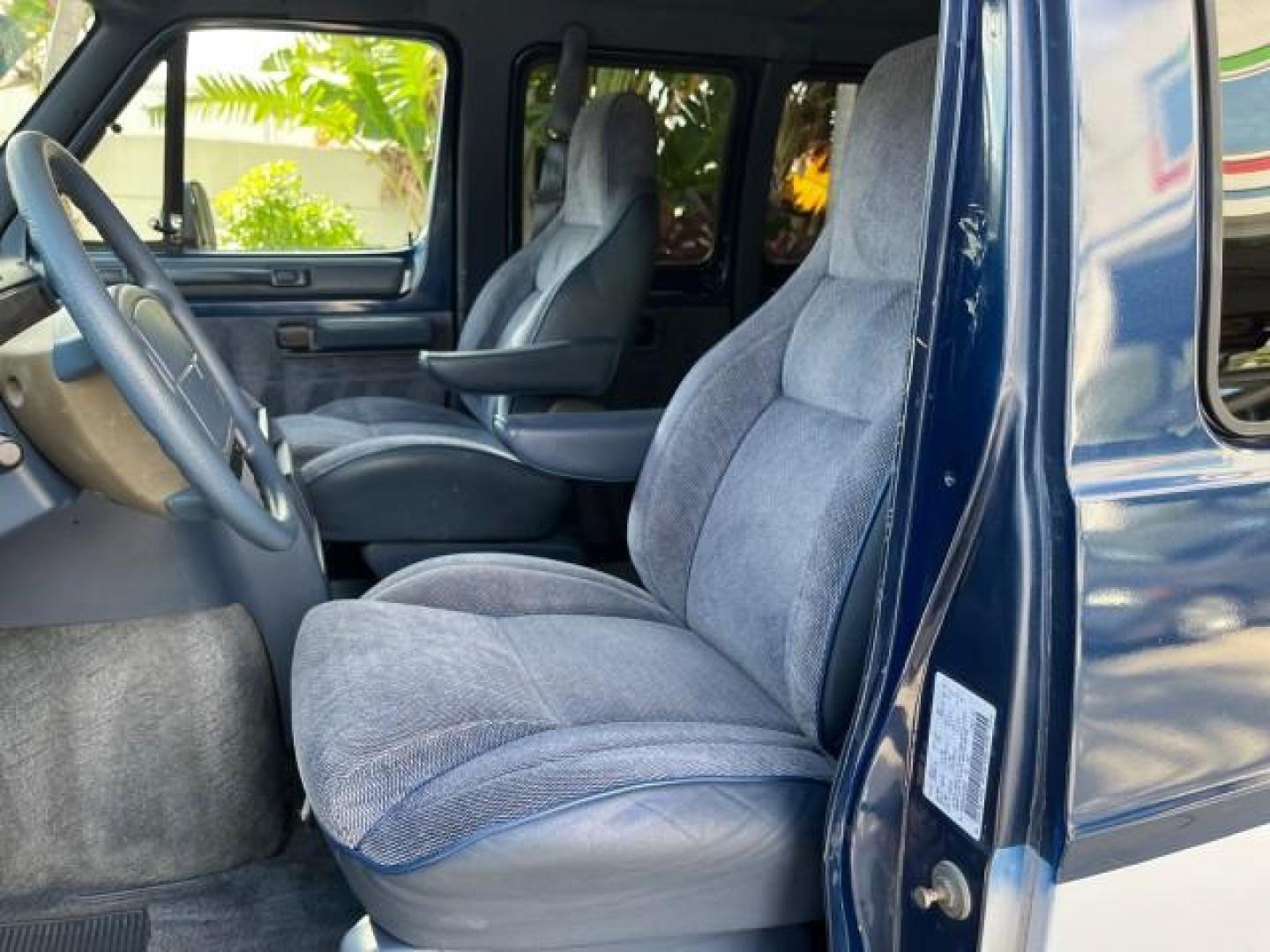 1995 BLUE /BLUE Dodge Ram Wagon EXT 15 PAS LOW MILES 69,523 (2B5WB35Z6SK) with an 5.9L MPI V8 Magnum Engine engine, Automatic transmission, located at 4701 North Dixie Hwy, Pompano Beach, FL, 33064, (954) 422-2889, 26.240938, -80.123474 - OUR WEBPAGE FLORIDACARS1.COM HAS OVER 100 PHOTOS AND FREE CARFAX LINK 1995 DODGE RAM VAN 3500 ROAD READY 5.9L V8 VIN: 2B5WB35Z6SK538547 NO ACCIDENTS VAN 15 PASSANGER 5.9L V8 F OHV 16V 4 ROW SEATS GASOLINE LOW MILES 69,523 REAR WHEEL DRIVE DUAL AC POWER MIRRORS Cloth Seats Running Boards Rear Air Con - Photo#61